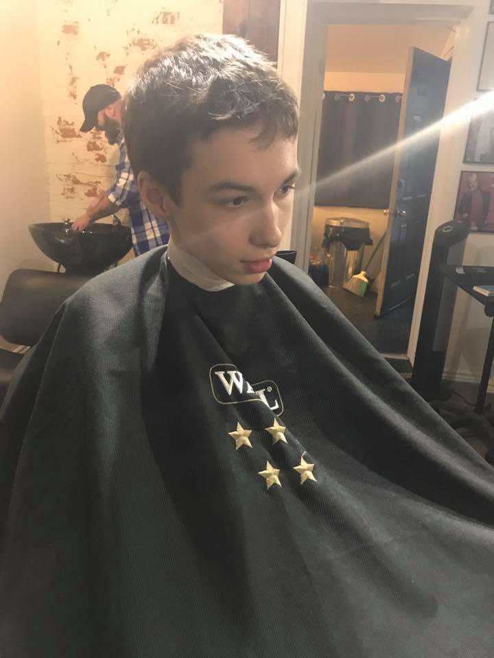 Aidan at Sparrows Hair Studio getting ready for his first ever cut in a salon