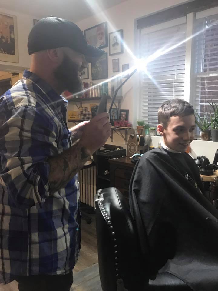 Magical moment: Aidan checking out his awesome haircut