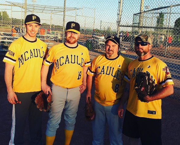 Home run: Pat McAuley (2nd from left) with some teammates from his baseball team