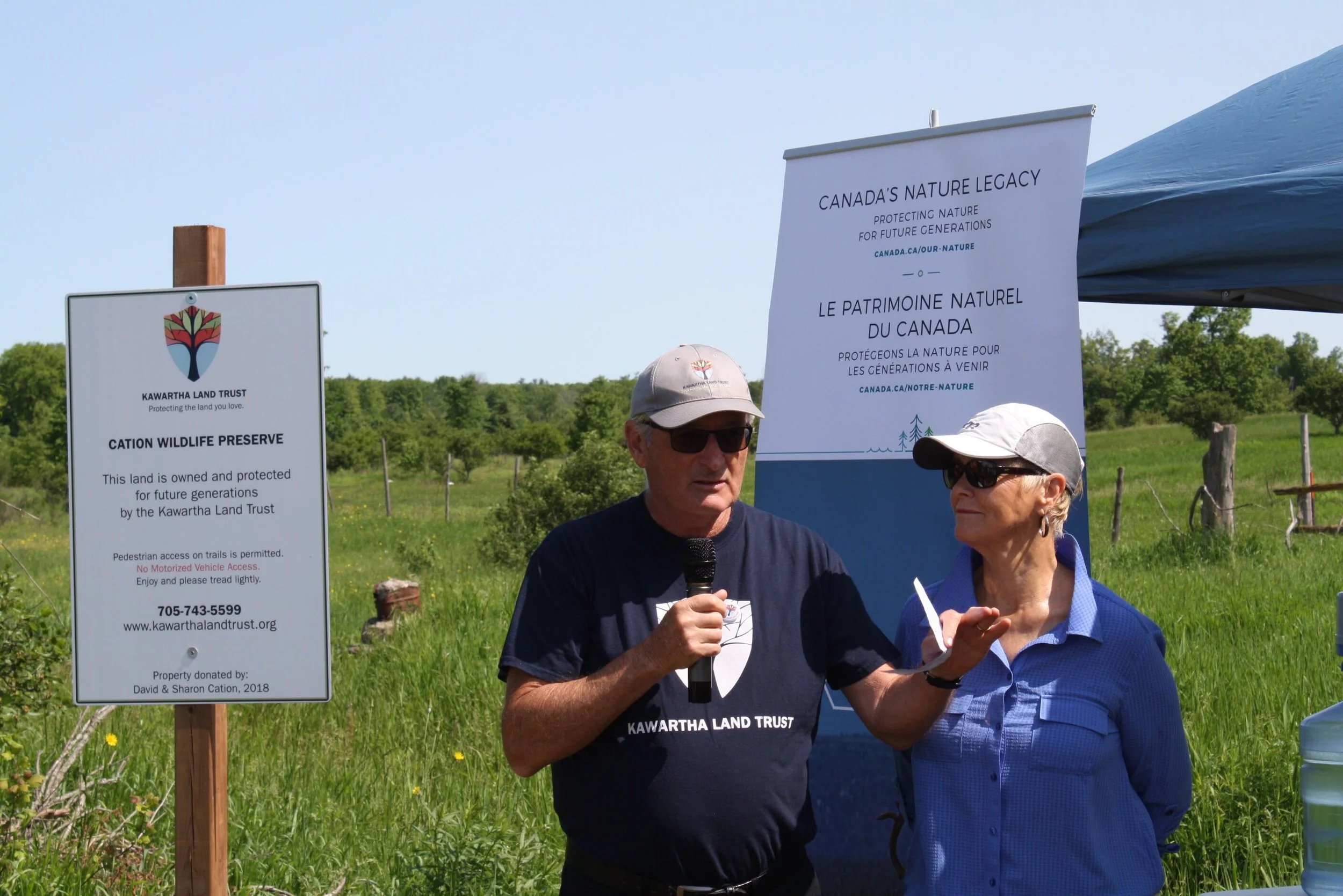 Dave and Sharon Cation address crowd at the grand opening of the Cation Wildlife Preserve
