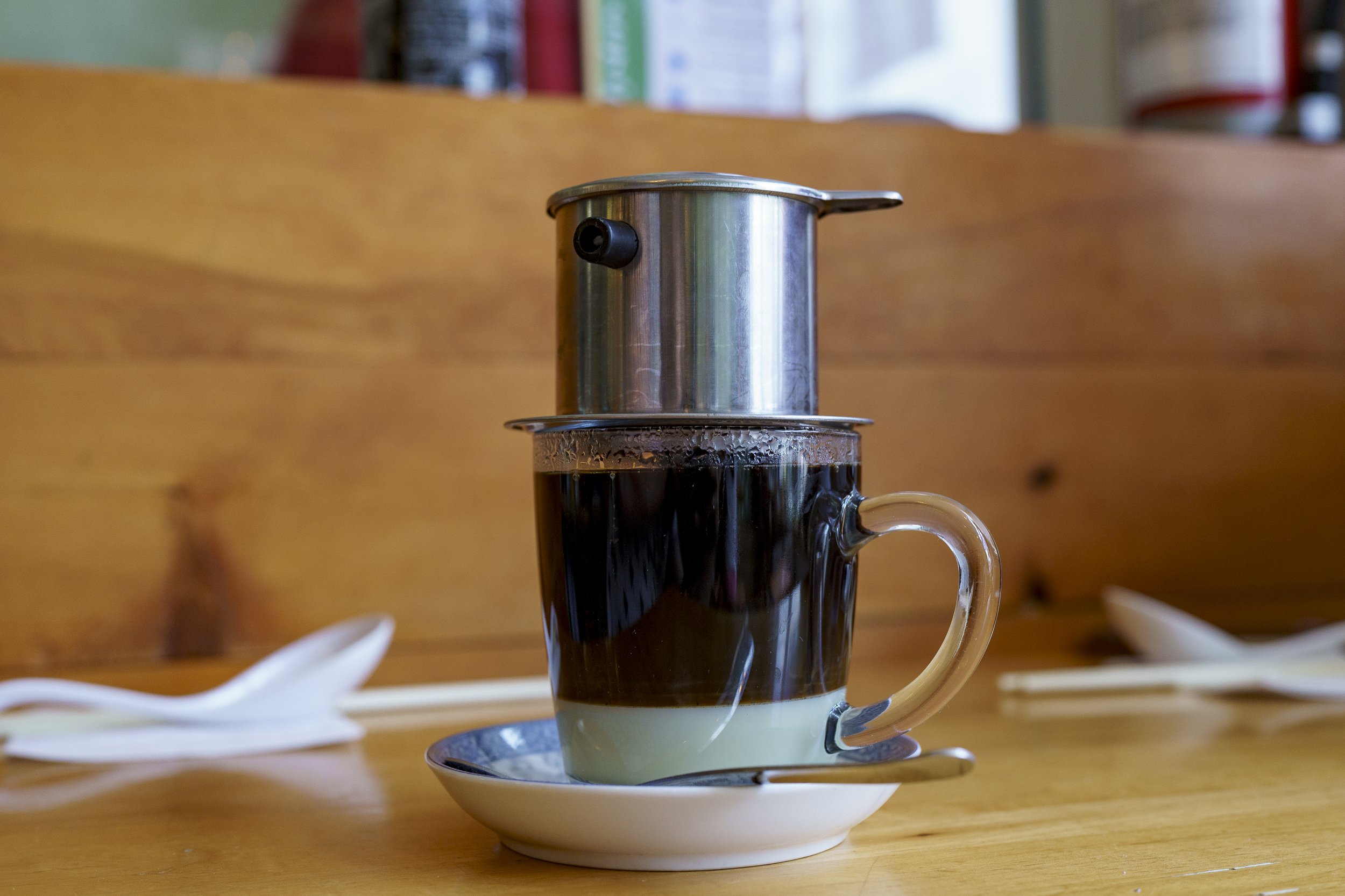  Vietnamese coffee is typically sweetened with condensed milk as the coffee is steeped over it before being mixed. Photo by Luke Best. 