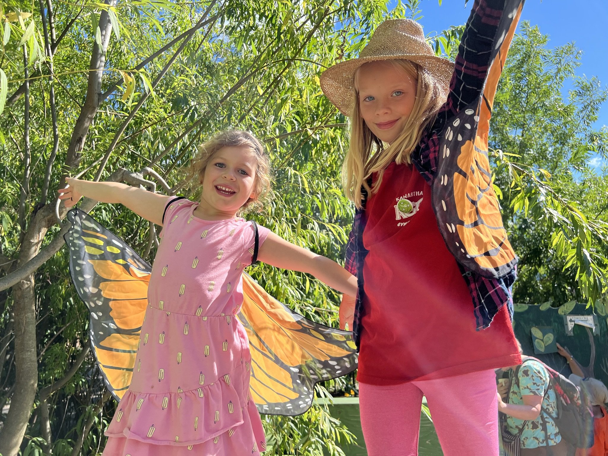  Lillian P. (left) and Ellie T. (right) showing off their butterfly wings at the Children’s Garden at GreenUP Ecology Park. All photos by David Tuan Bui. 