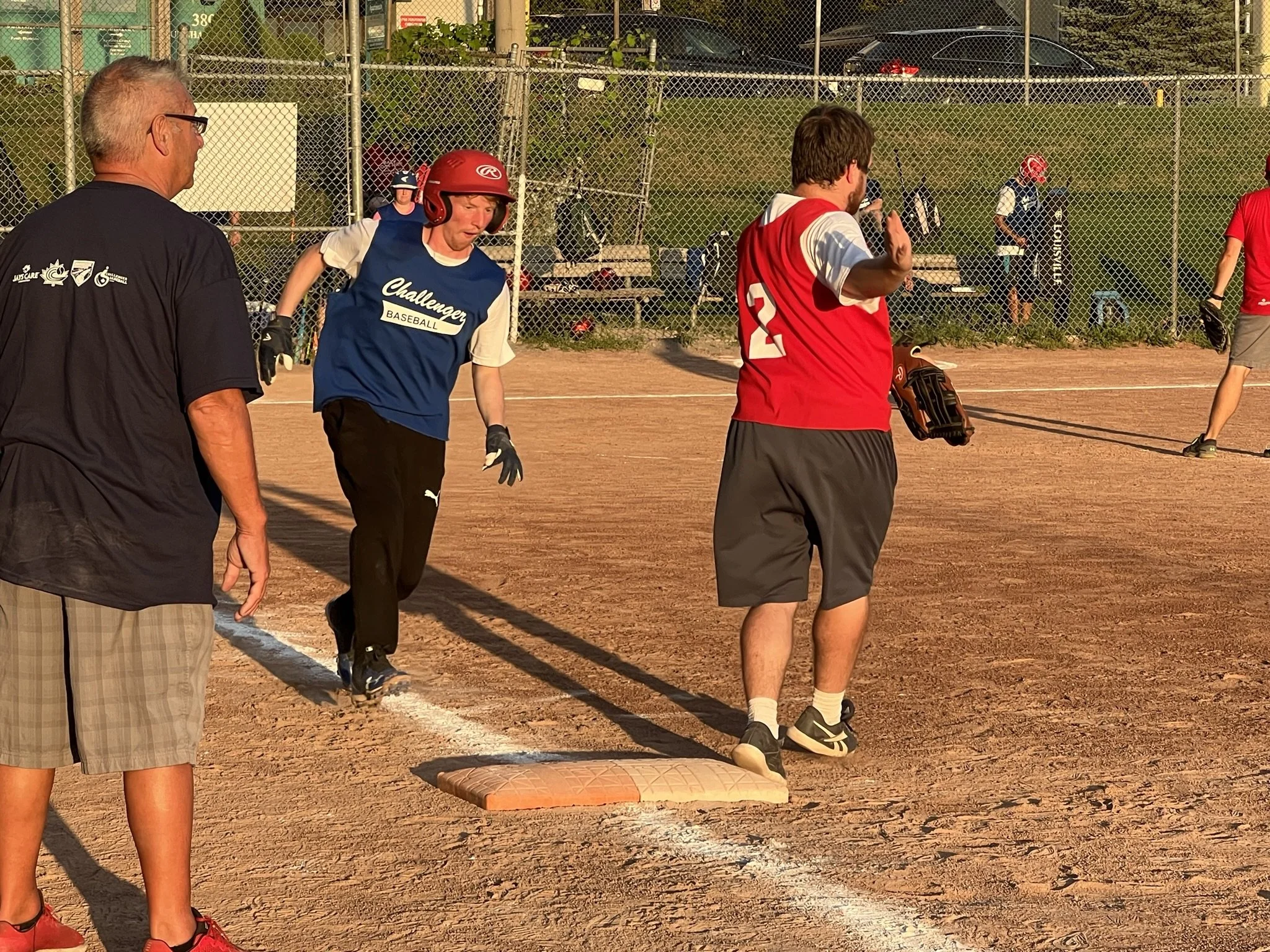  Quinton Over (blue) gets a base hit and ponders about going for second base. All photos by David Tuan Bui. 