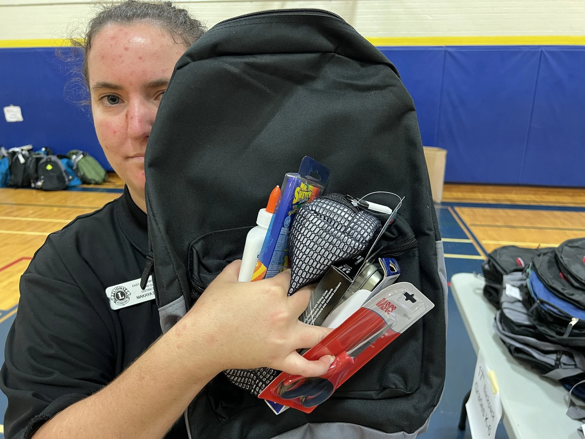  Makaya Dafoe of the East Peterborough Lions Club puts on display all the items each student will receive for the upcoming school year. All Photos by David Tuan Bui. 
