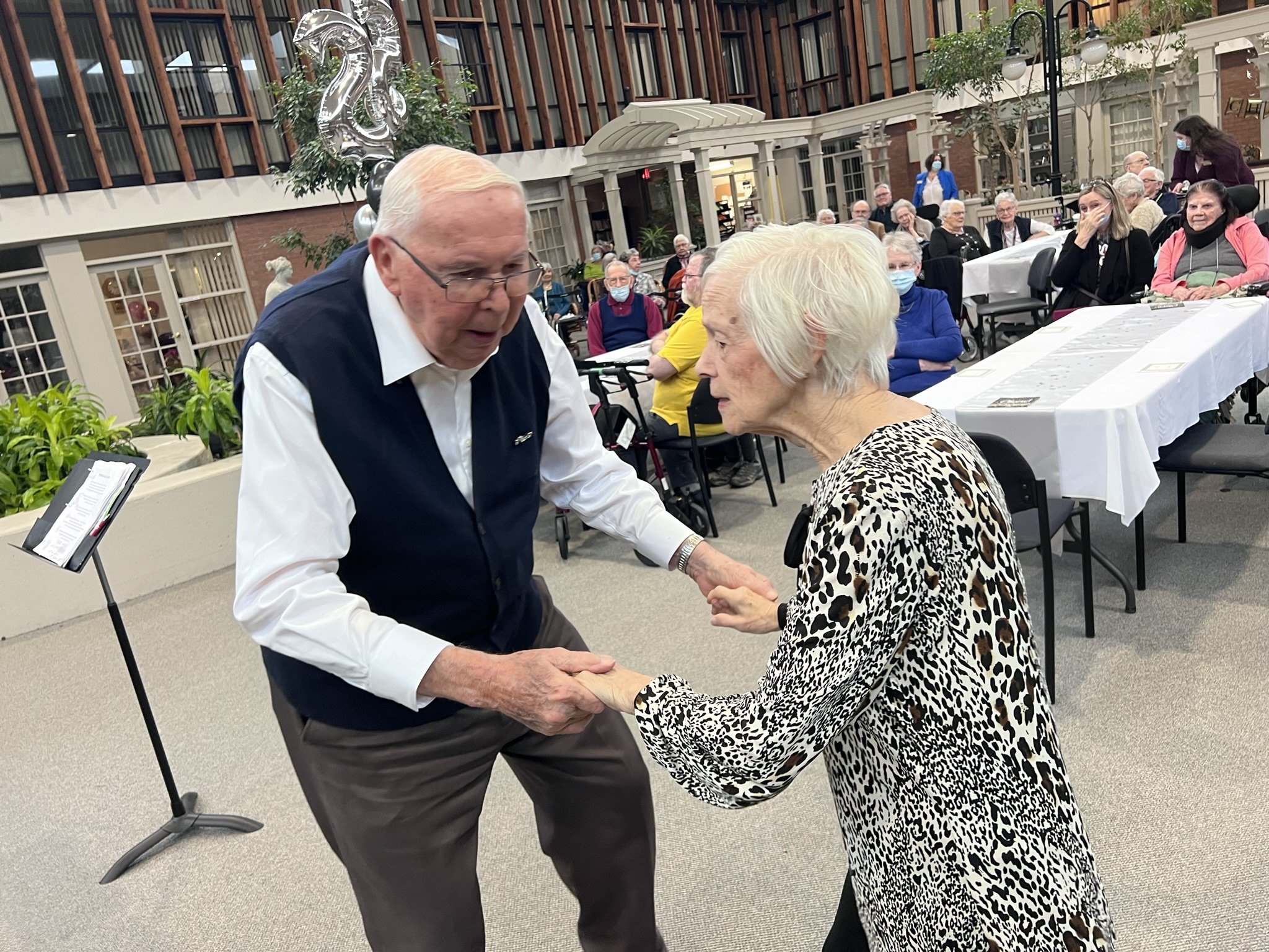 David Reed, 94 (left) and Marilyn Hartley, 83 (right) are first to hit the dance floor when the jazz band got jamming. All photos by David Tuan Bui.