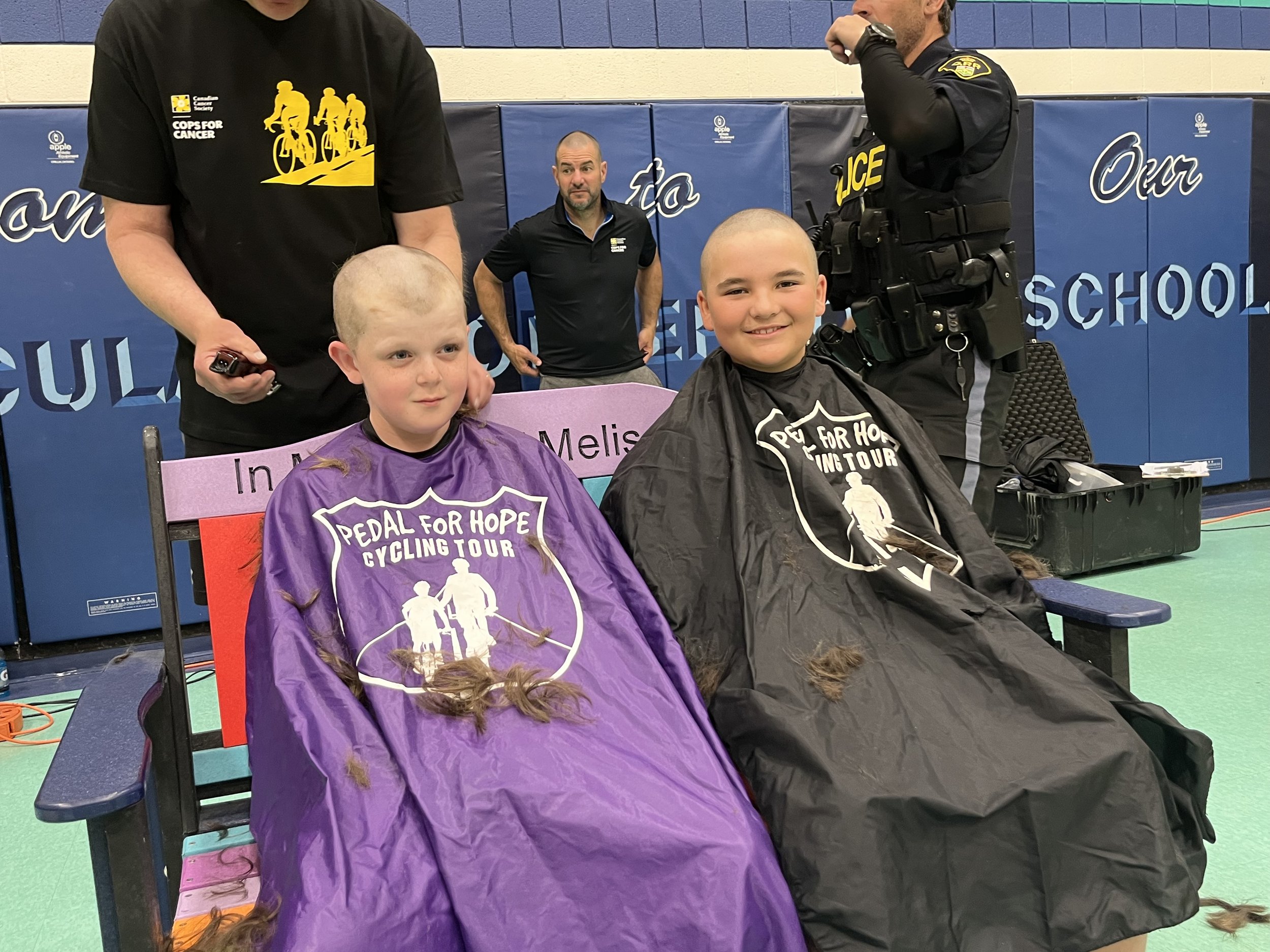  Students Finn and Giovanni getting their heads shaved. 