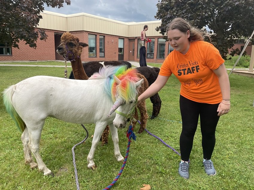  A ‘unicorn’ from Critter Visits was on hand for the recent Backyard Summer Social, allowing event attendees to enjoy a petting zoo as part of the many festivities. Photo courtesy of Five Counties Kids. 