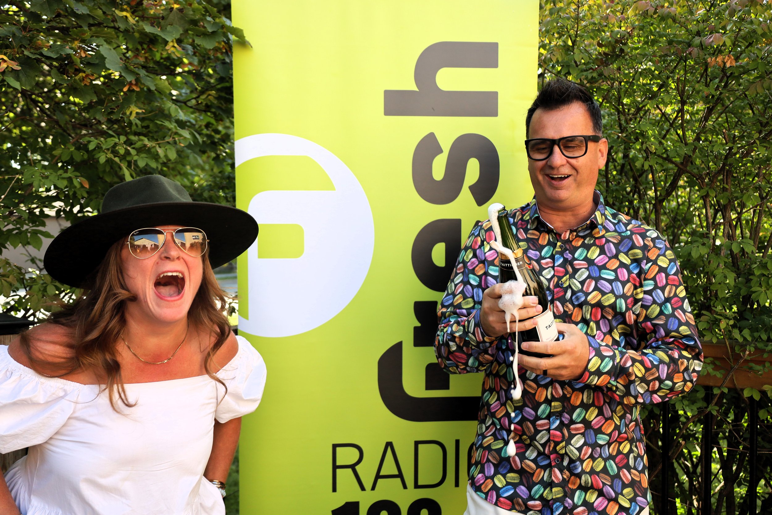 An unexpected champagne cork pop leads to a bubbly surprise for Dani Guppy (left) and Pete Dalliday (right). All photos by David Tuan Bui.