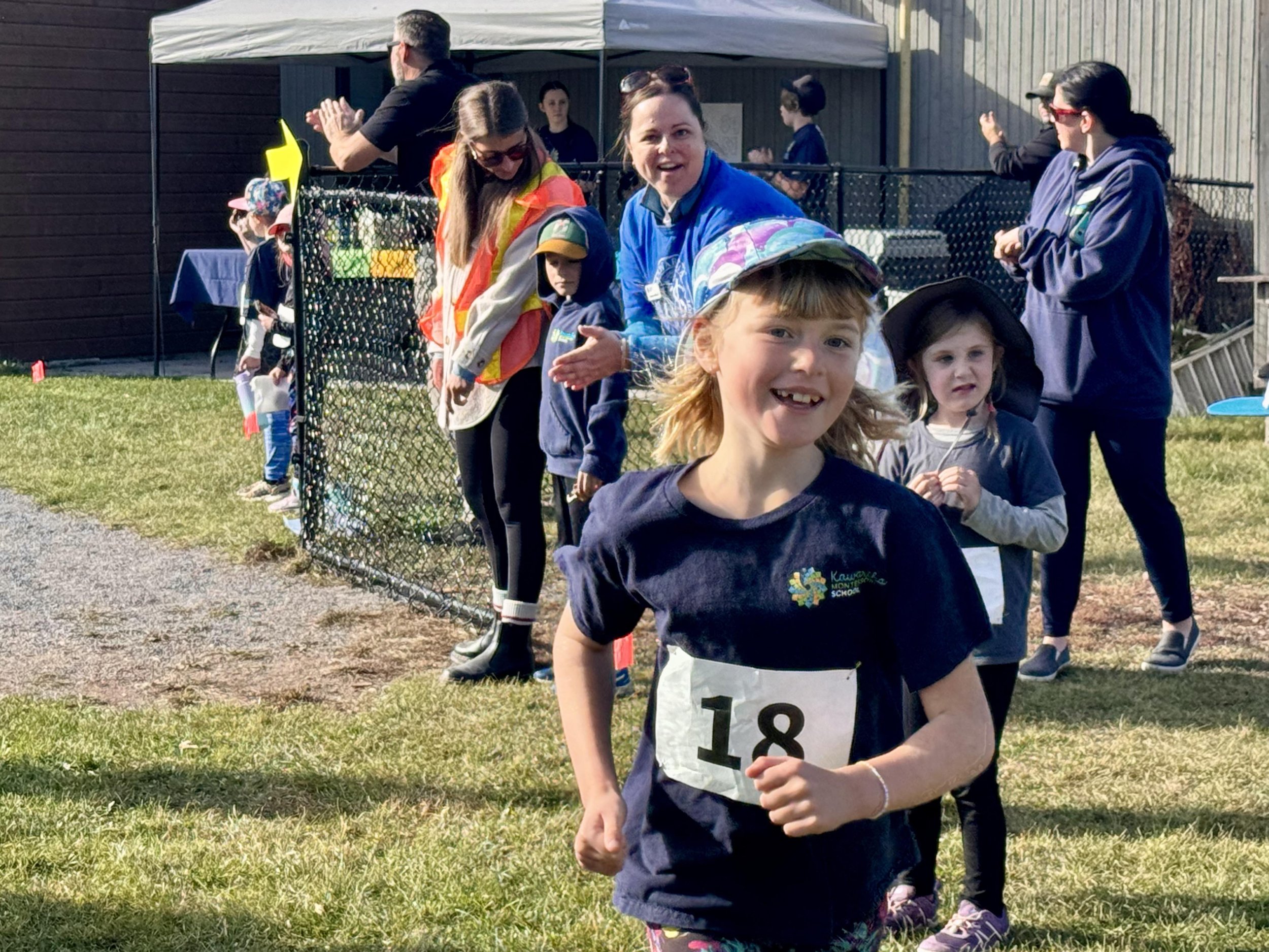  Grade 3 student Esther van Ostveen, 8, running in her heat as students, parents and faculty cheered the racers all day. All photos by David Tuan Bui.