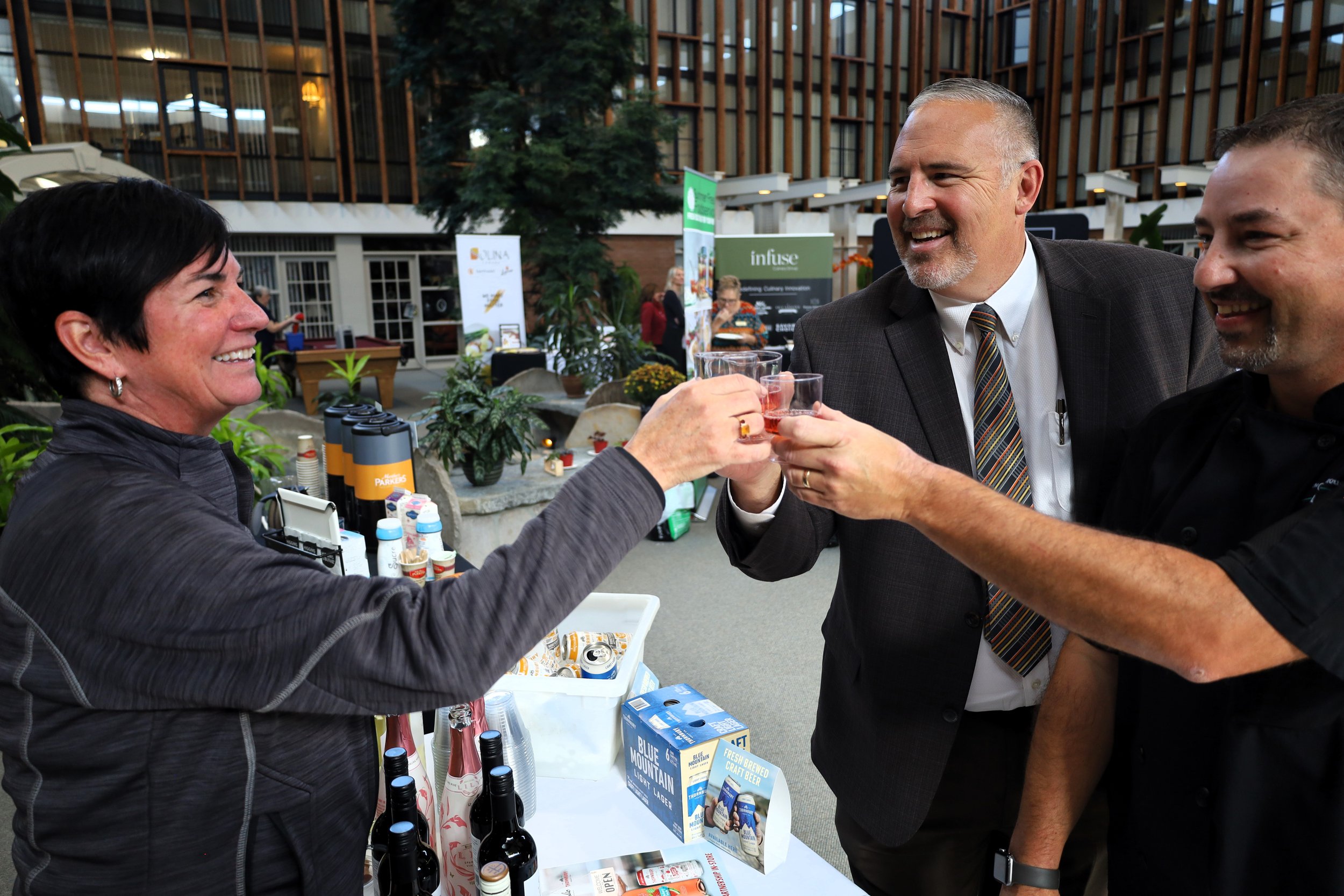 Teri Penfound, Colio Estate Wines area manager (left); Ray Barlow, AON Inc. VP (middle) and Dan Leal, director of dining services (right) enjoying a wine sample. All Photos by David Tuan Bui.