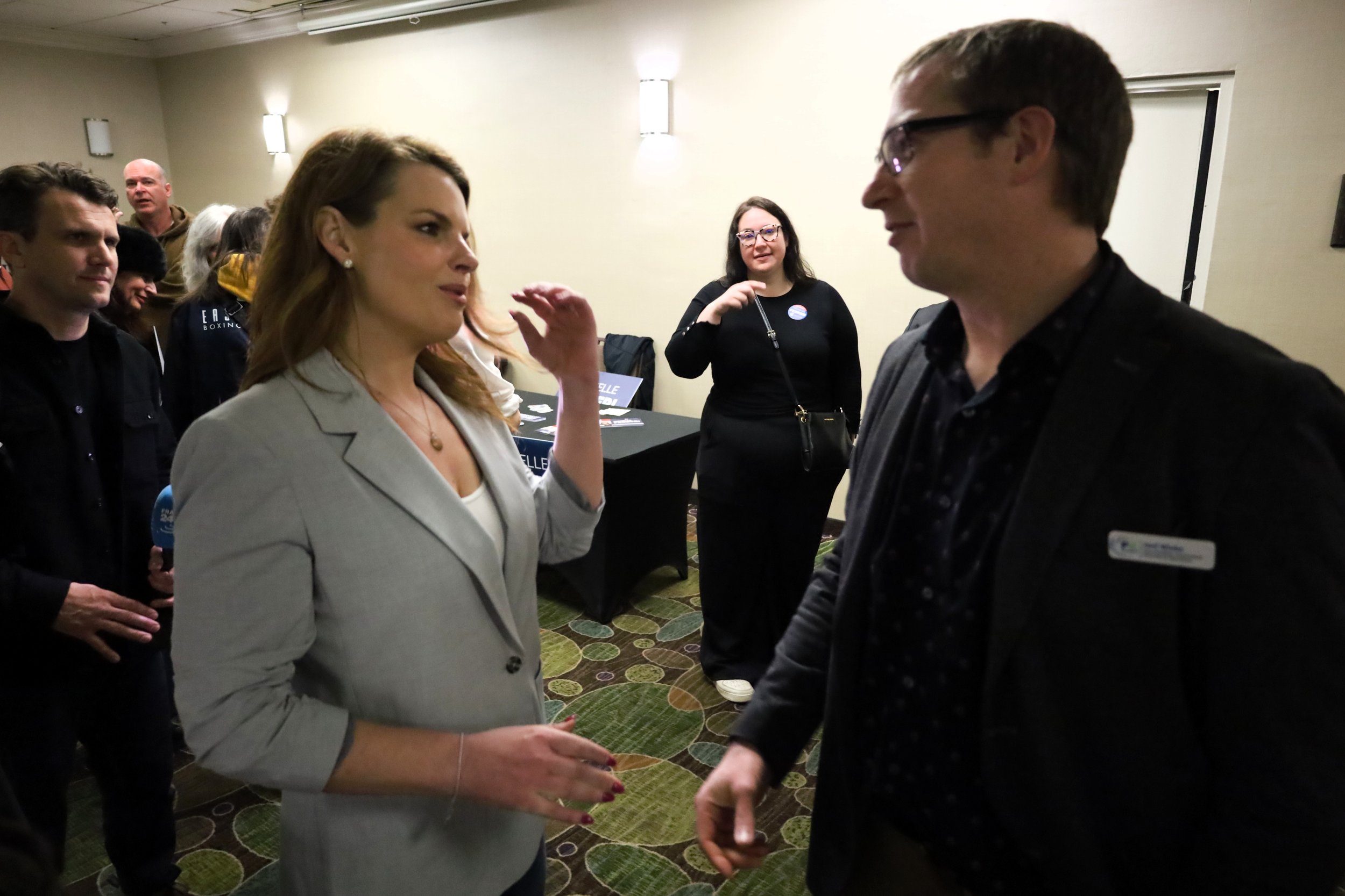 Conservative candidate and incumbent Michelle Ferrari (left) being thanked by Joel Wiebe (right) of the Peterborough Chamber for attending. All photos by David Tuan Bui.