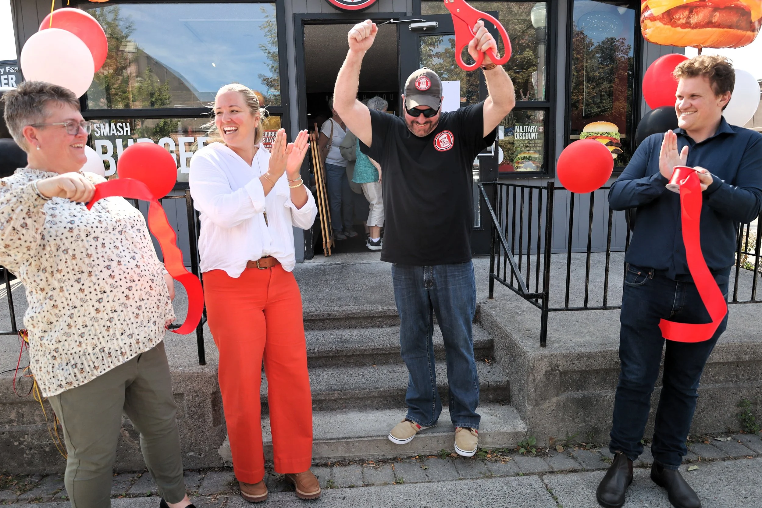 Jamie Law, Law &amp; Orders founder (third from left) celebrates his grand opening in Peterborough with Chamber of Commerce and Community Futures Peterborough members. All photos by David Tuan Bui.