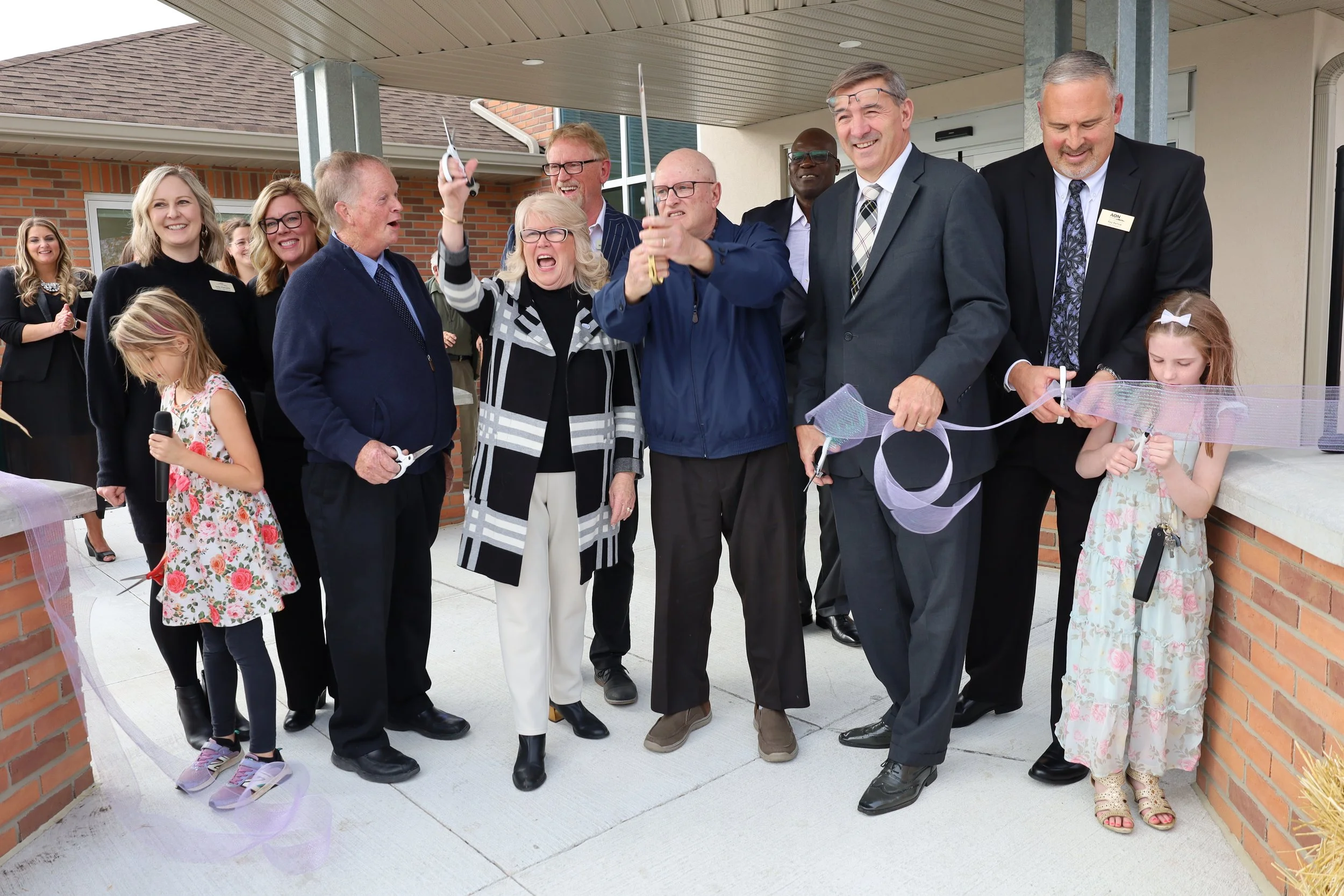 Dignitaries and AON Inc. staff cut the ribbon to mark the grand opening of Station Place Long-Term Care Home in Havelock. All Photos by David Tuan Bui.