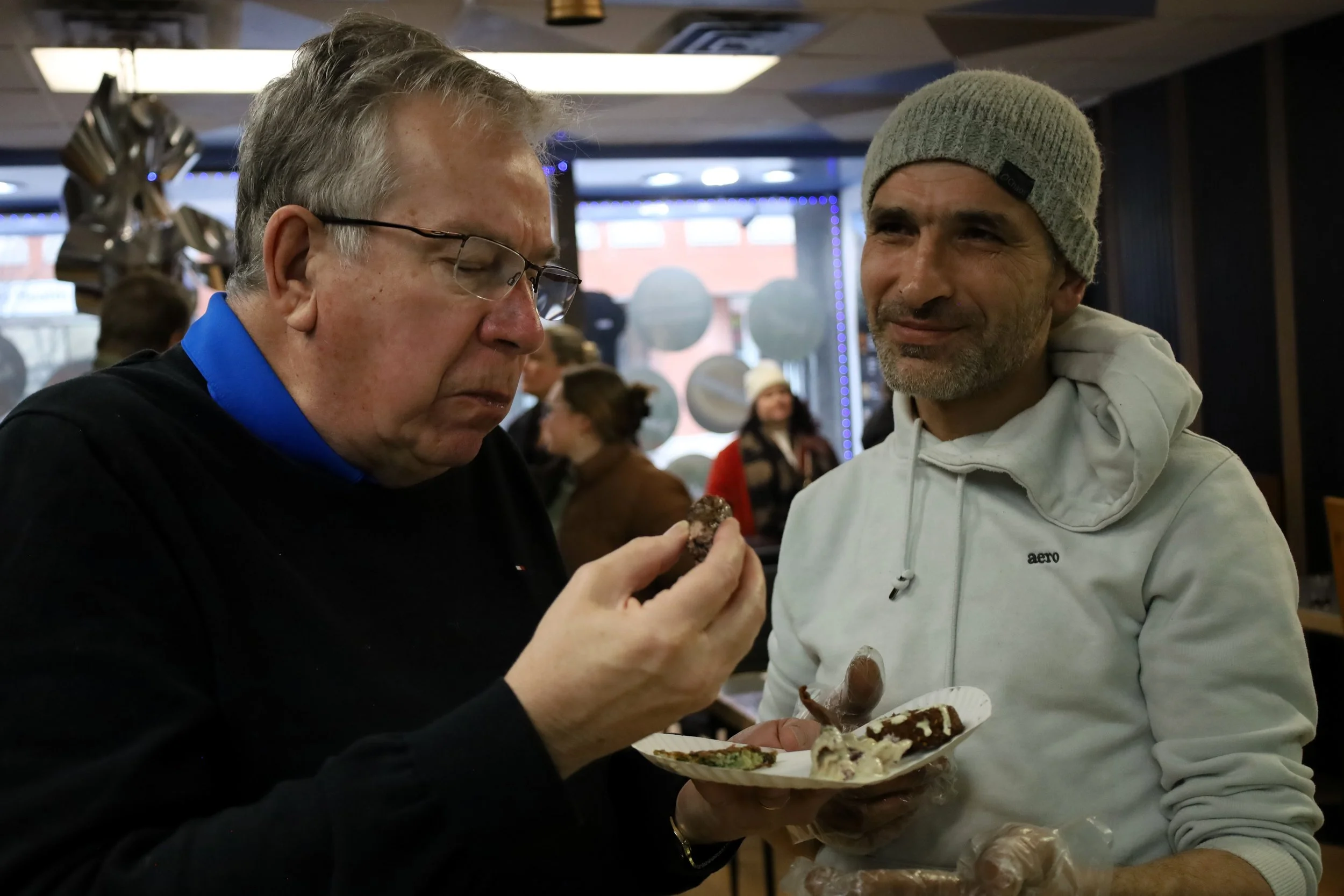 Mayor Jeff Leal (left) samples Amhed El Nime (right) and Aleppo Castle's beef kebab as one of several dishes served for the attendees. All photos by David Tuan Bui.