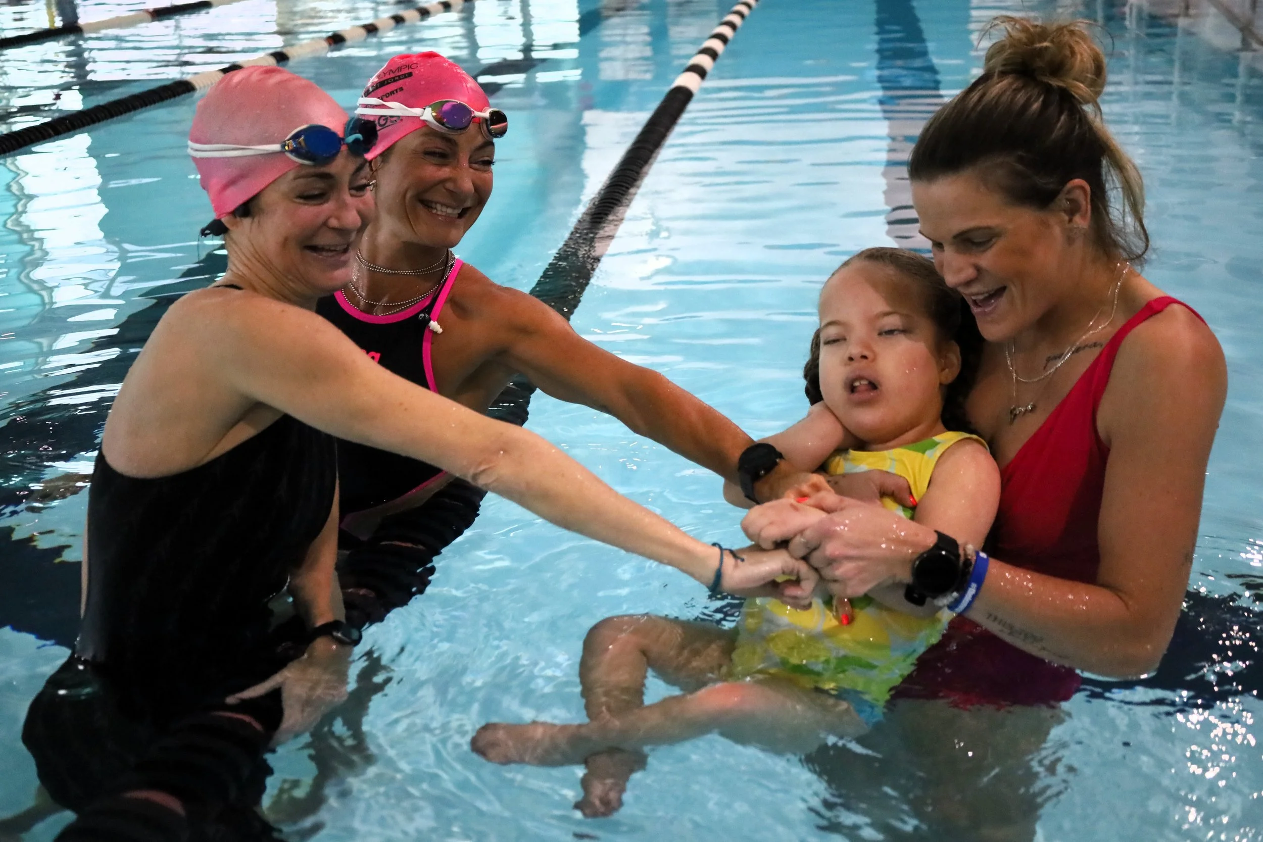 (From left to right) Leslie and Renee Oake are having some poolside fun with Easter Seals Ambassador Zoe Gibbons and her mother, Sarah-Lynne Gibbons. All photos by David Tuan Bui.