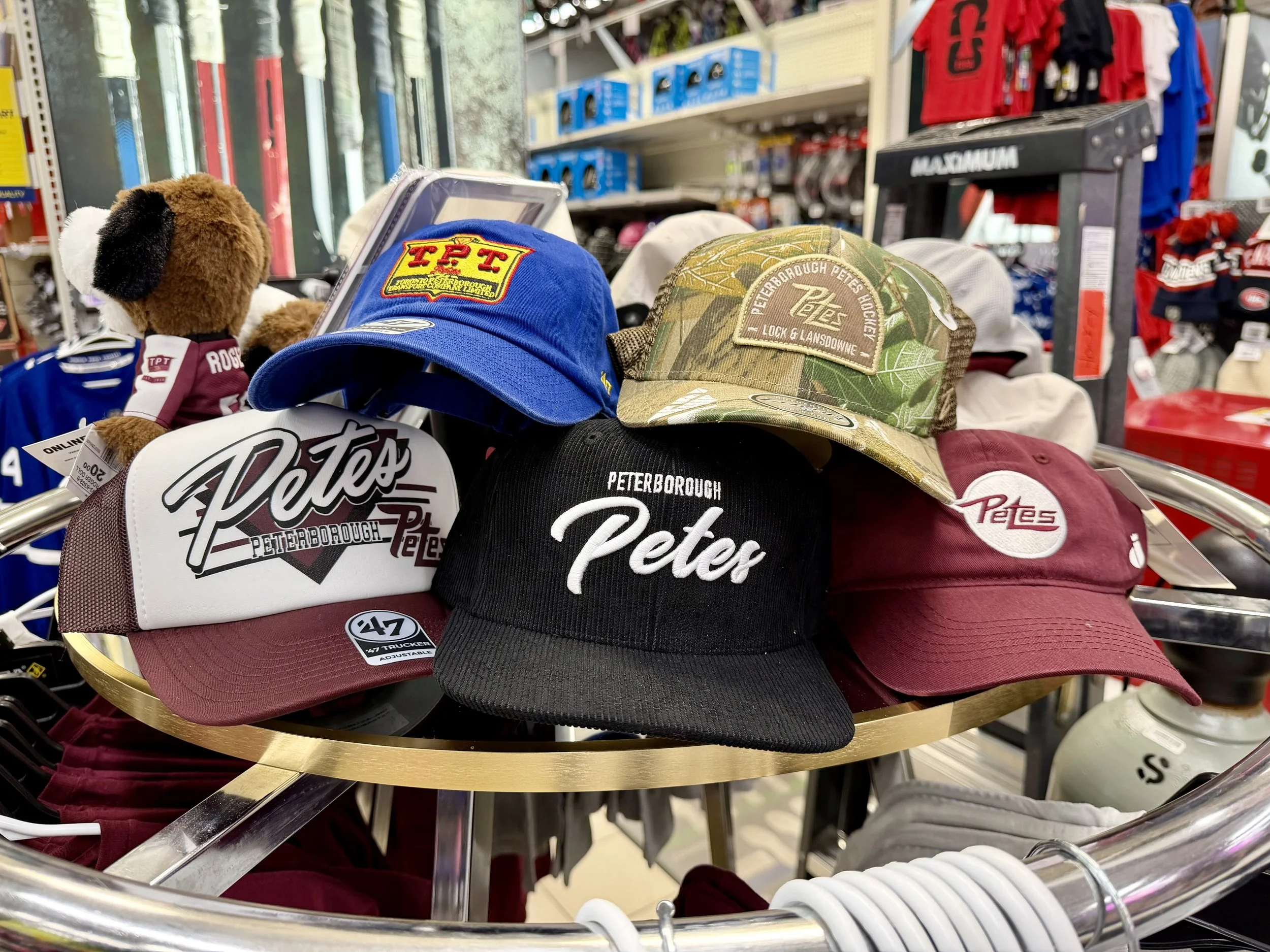 The display offers a range of merchandise for fans of all ages, including toddler, youth and adult t-shirts, hats, mini sticks, bar mats and vacuum-sealed mugs.