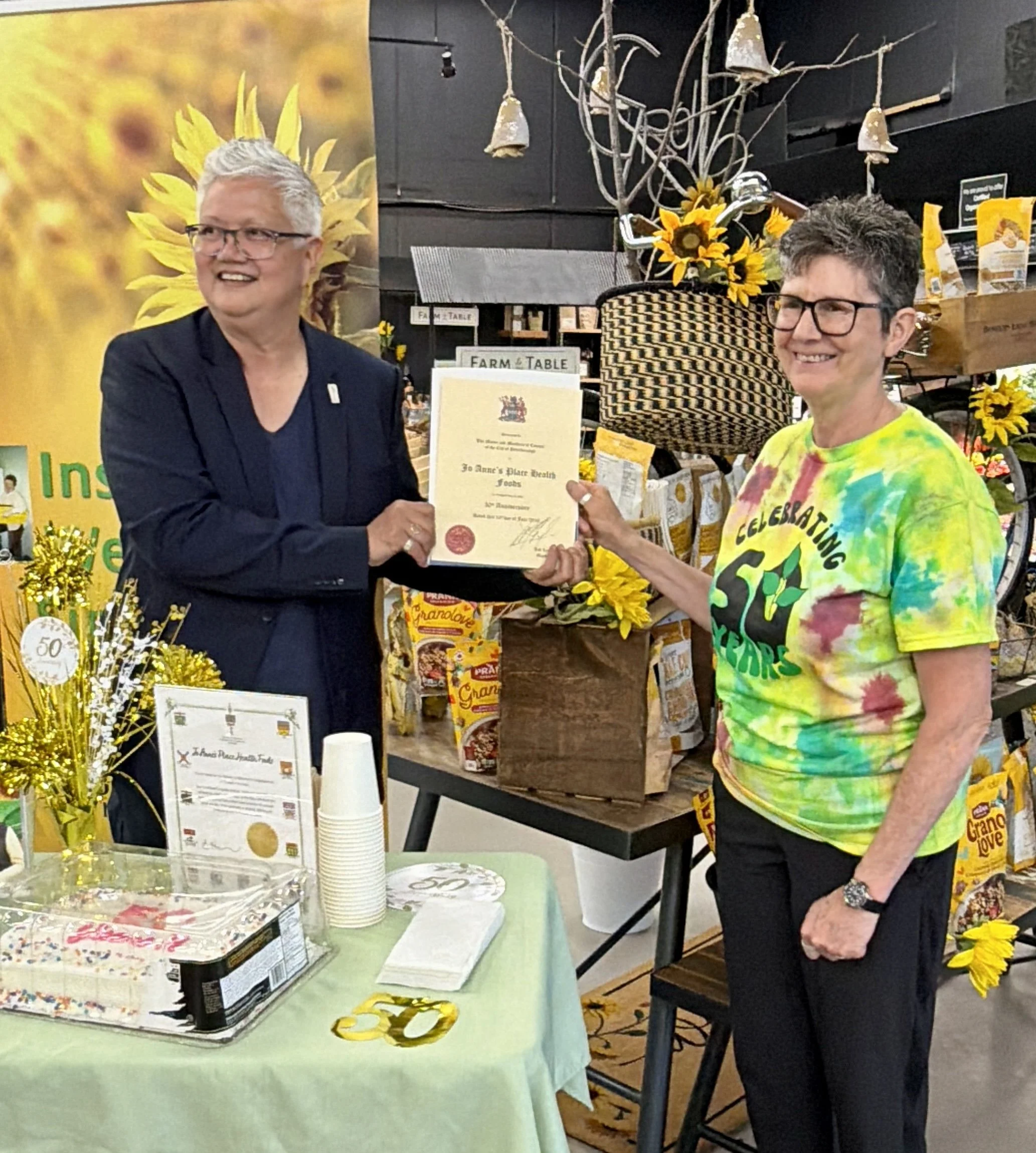joy lachica presented a certificate to jo anne's place on behalf of the city of peterborough