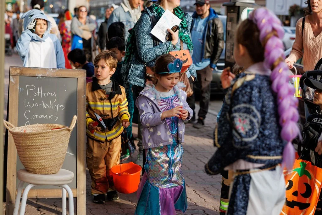 More than 50 local businesses are opening their doors to trick-or-treaters on Saturday, October 24th, with a costume contest, a hidden pumpkin hunt and a free outdoor screening of Goosebumps to keep the Halloween fun going.