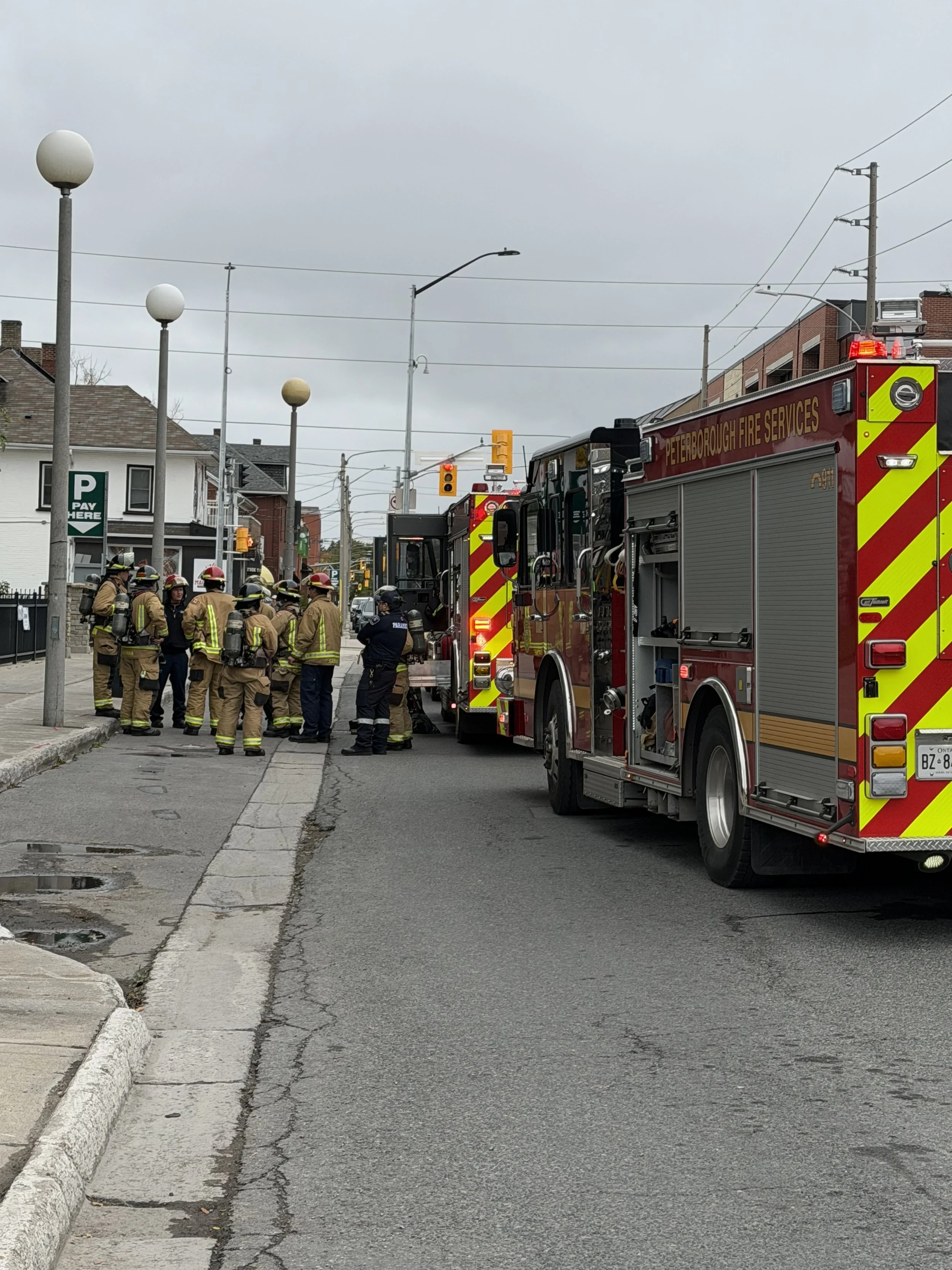 Firefighters respond to a balcony fire on the seventh floor of Charlotte Towers in downtown Peterborough on October 14th.