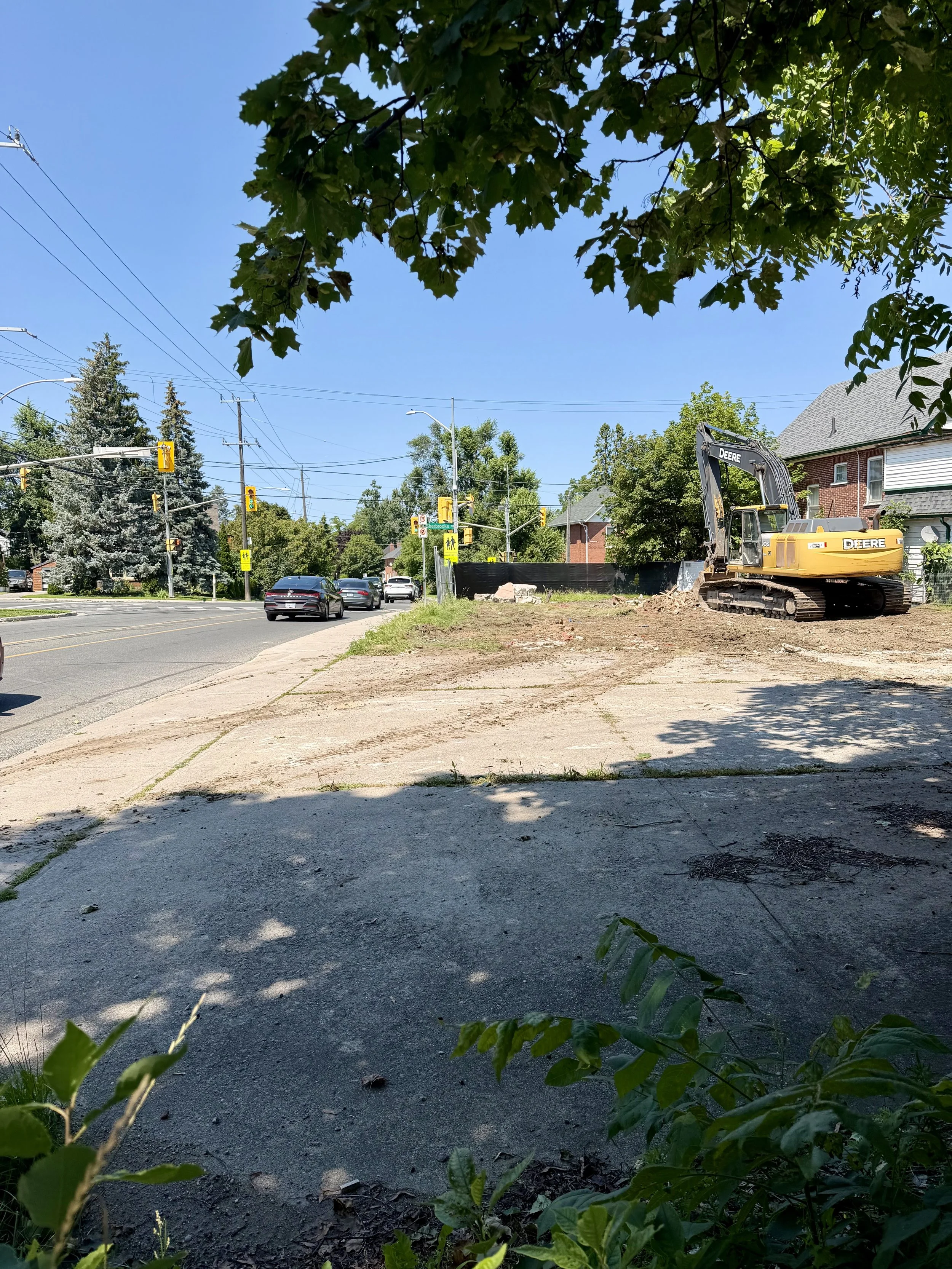 Heavy equipment clears debris from the site after much of the house was demolished at the corner of Sherbrooke Street and Monaghan Road.