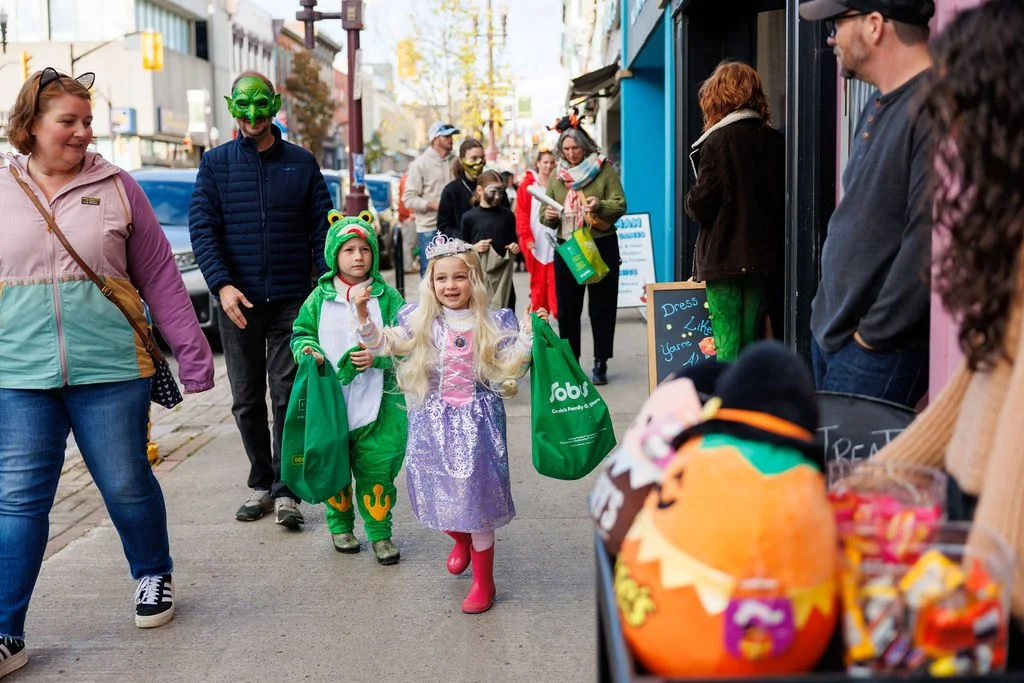 More than 50 local businesses are opening their doors to trick-or-treaters on Saturday, October 24th, with a costume contest, a hidden pumpkin hunt and a free outdoor screening of Goosebumps to keep the Halloween fun going.