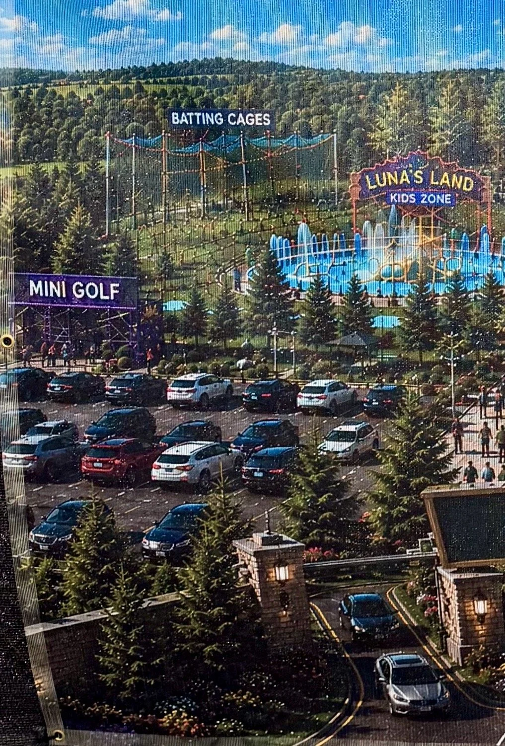 New "Coming Soon" signs at the former Wild Water & Wheels property offer the first look at what could be coming to the long-vacant site on Chemong Road. (Photo by Scott Arnold)