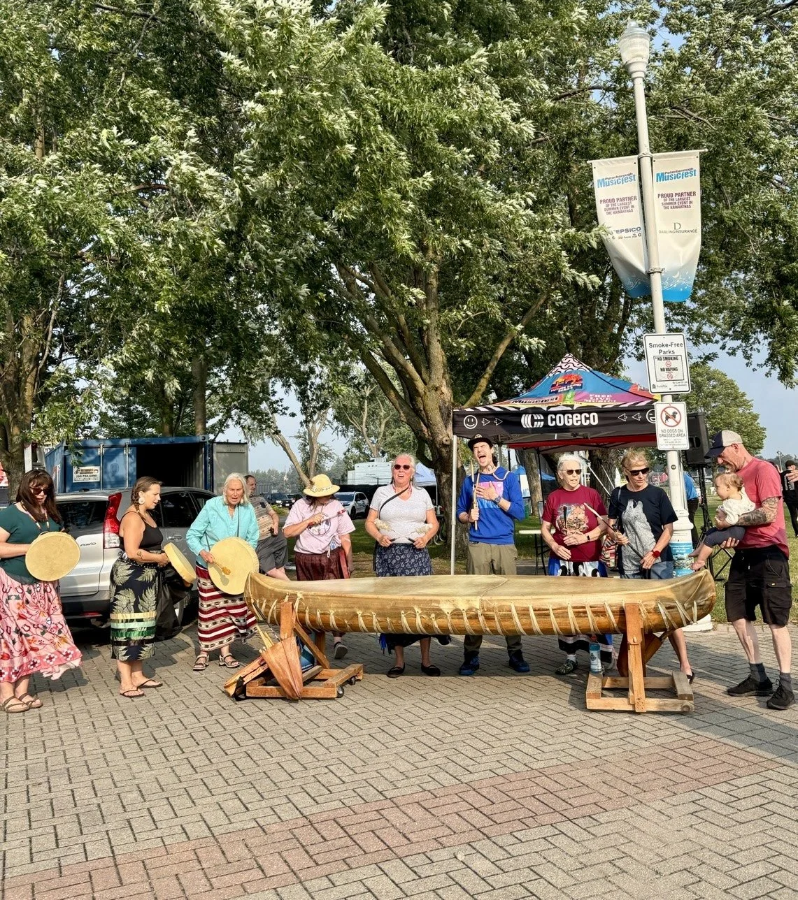 the canoe drum to the entrance of the park, where visitors were invited to take part in an interactive drumming experience before the show.