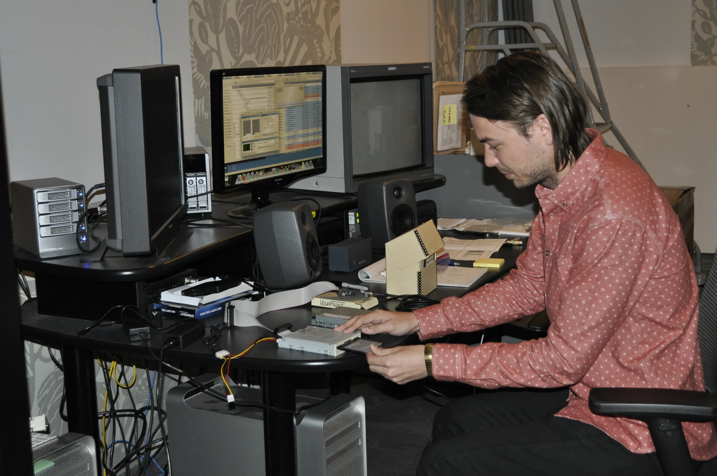 Totally candid picture of me mounting a 3.5" floppy disk at my workstation 