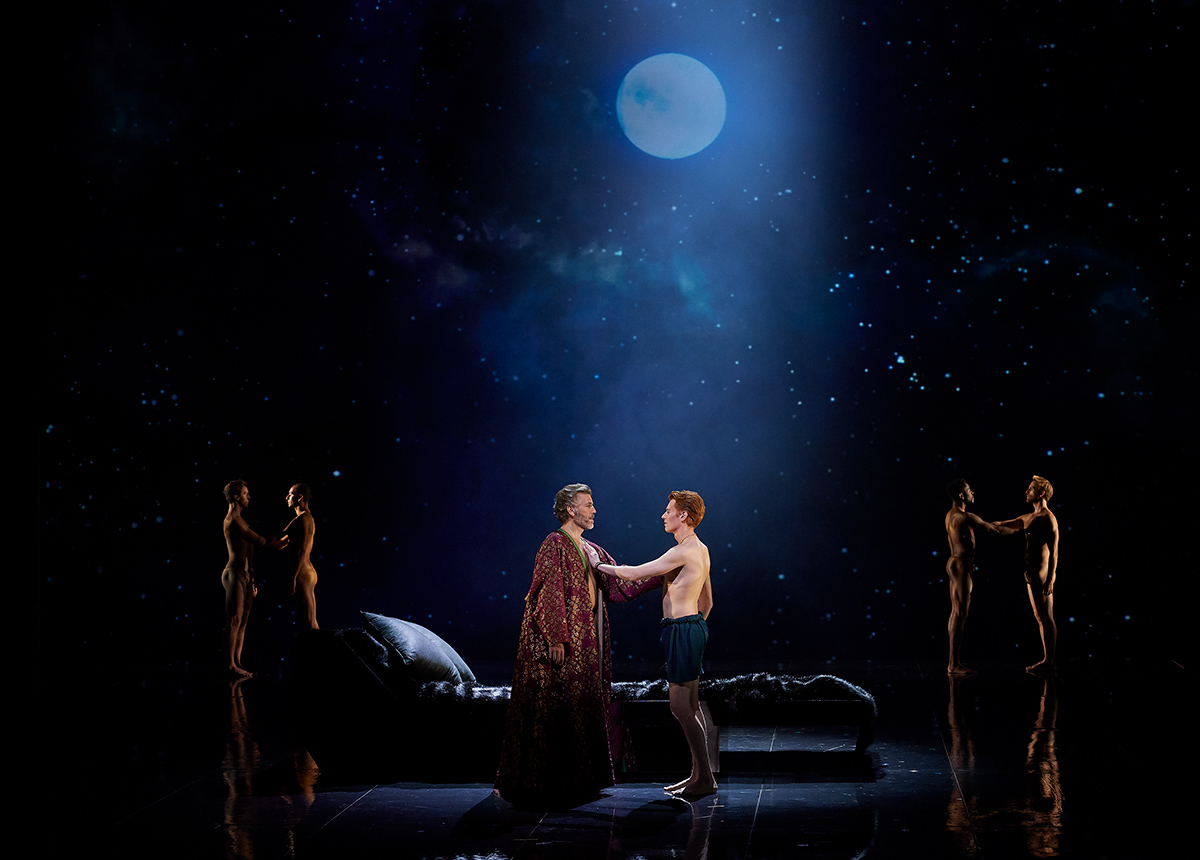 Thomas Hampson as Hadrian and Isaiah Bell as Antinous in the Canadian Opera Company ’s world premiere production of Hadrian , Composer Rufus Wainwright and librettist Daniel MacIvor 2018. Conductor Johannes Debus, director Peter Hinton, set designer Michael Gianfrancesco, costume designer Gillian Gallow, lighting designer Bonnie Beecher, projection designer Laurie-Shawn Borzovoy, and choreographer Denise Clarke. Photo: Michael Cooper