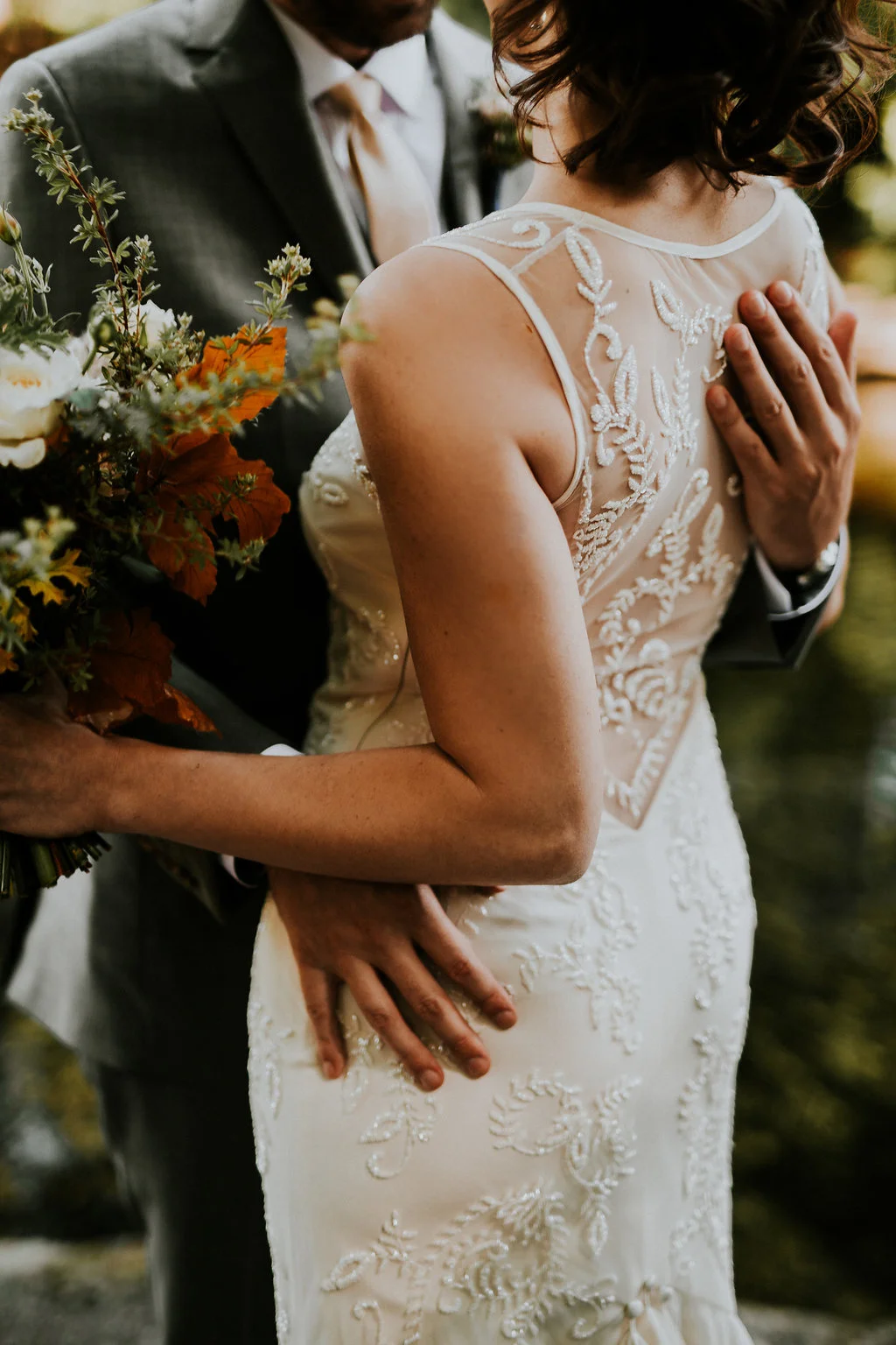 Fall wedding flowers with backless dress
