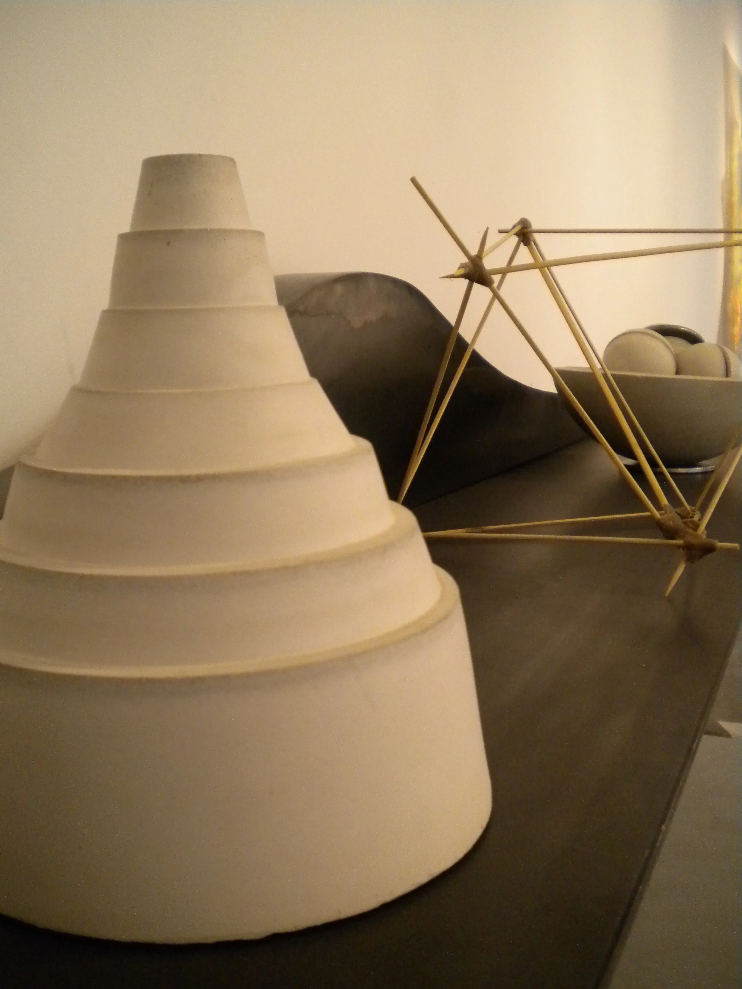   Topo White. 11”x 7”.   Cast concrete.  Form found from roofing debris. 