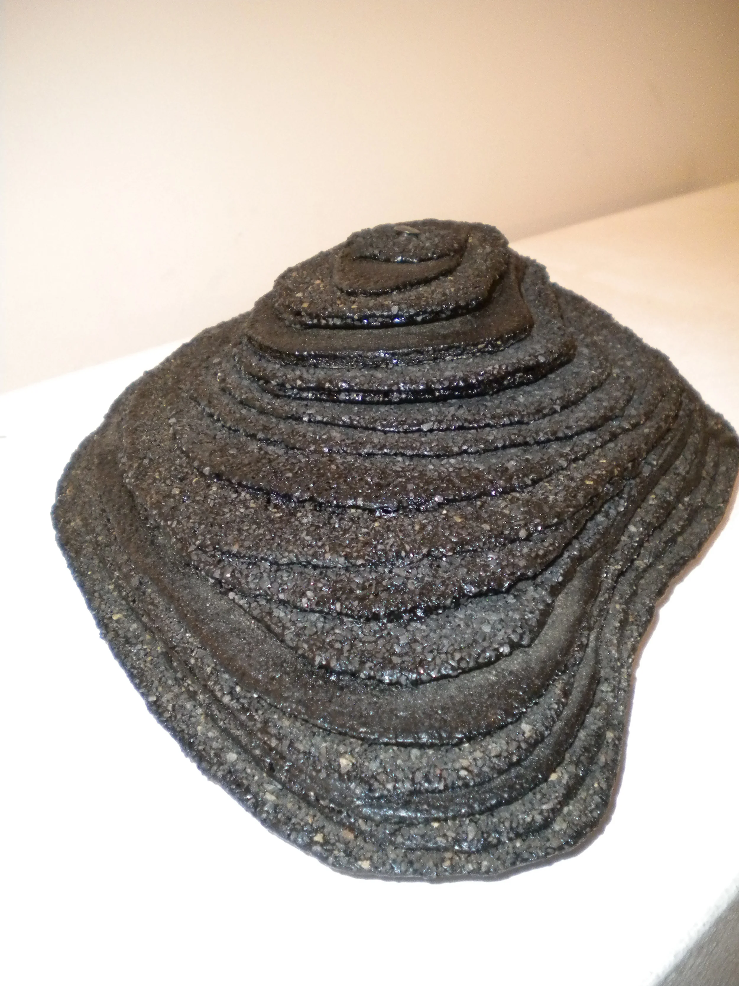   Topo Black.  10”x 5”x 4”. Torched and torn asphalt shingles. 