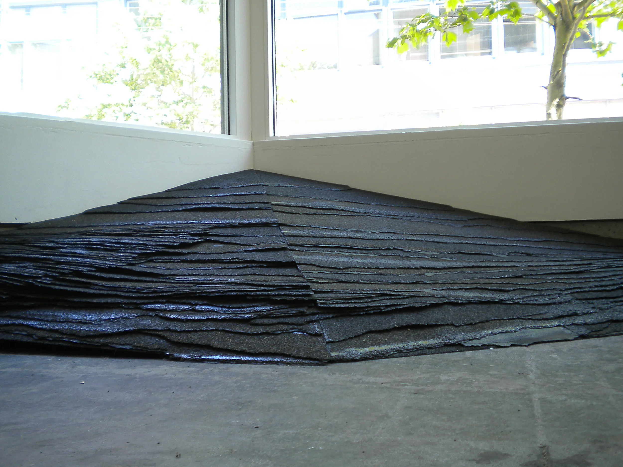   KING Tide.  5’x 3’x 18”. Torn and torched asphalt tiles. 