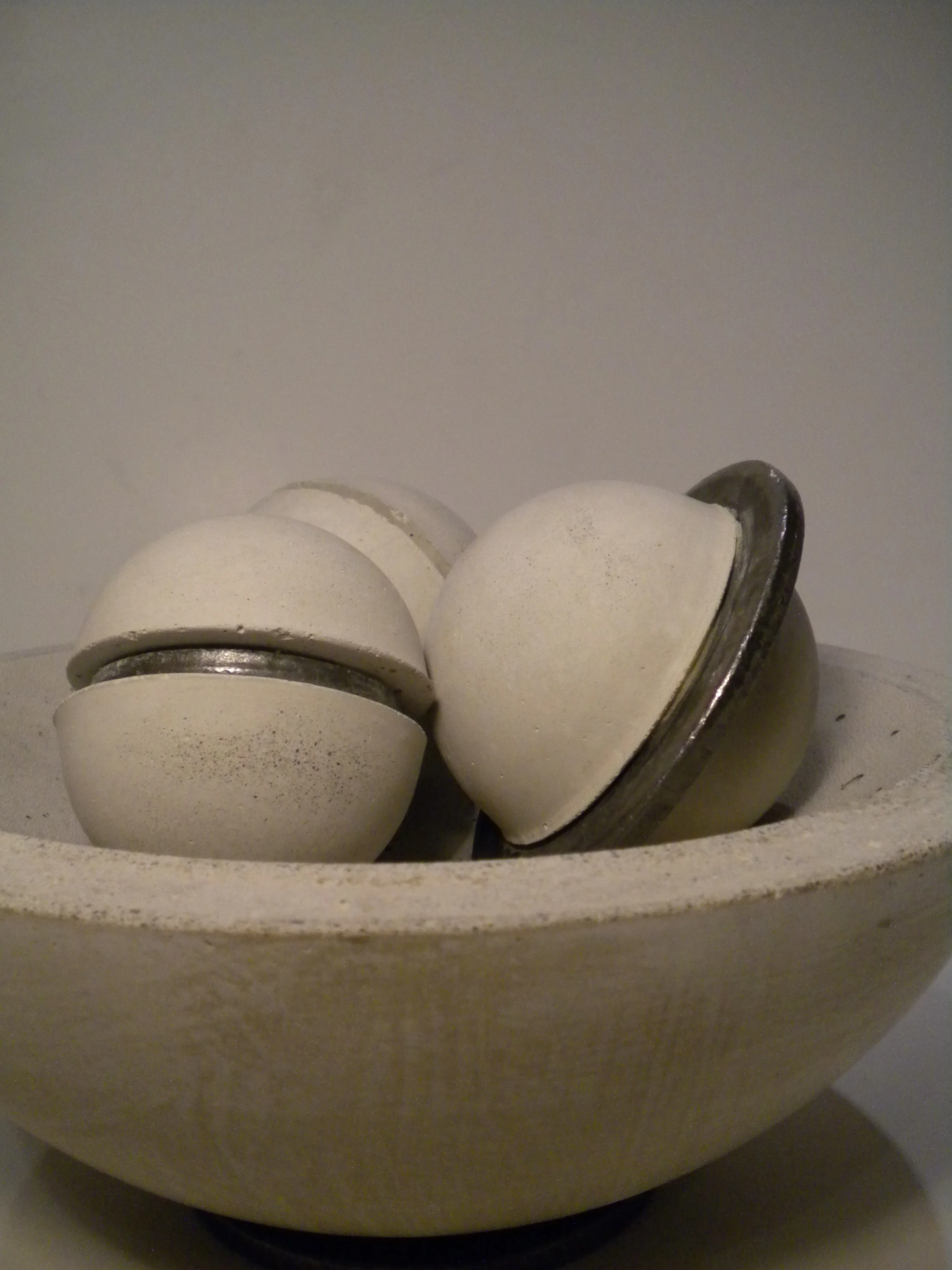   little planets.   Each 4” diameter. Steel and cast concrete. 