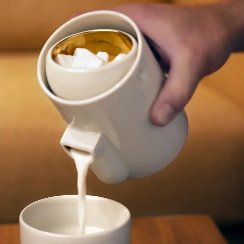 nickelcobalt:

Tonfisk’s Newton is a new way of serving milk and sugar. The clever mechanism in Newton is based on gravity; you can pour the milk without removing the attached sugar bowl. While you tip the milk jug, the sugar bowl remains level. Sma…