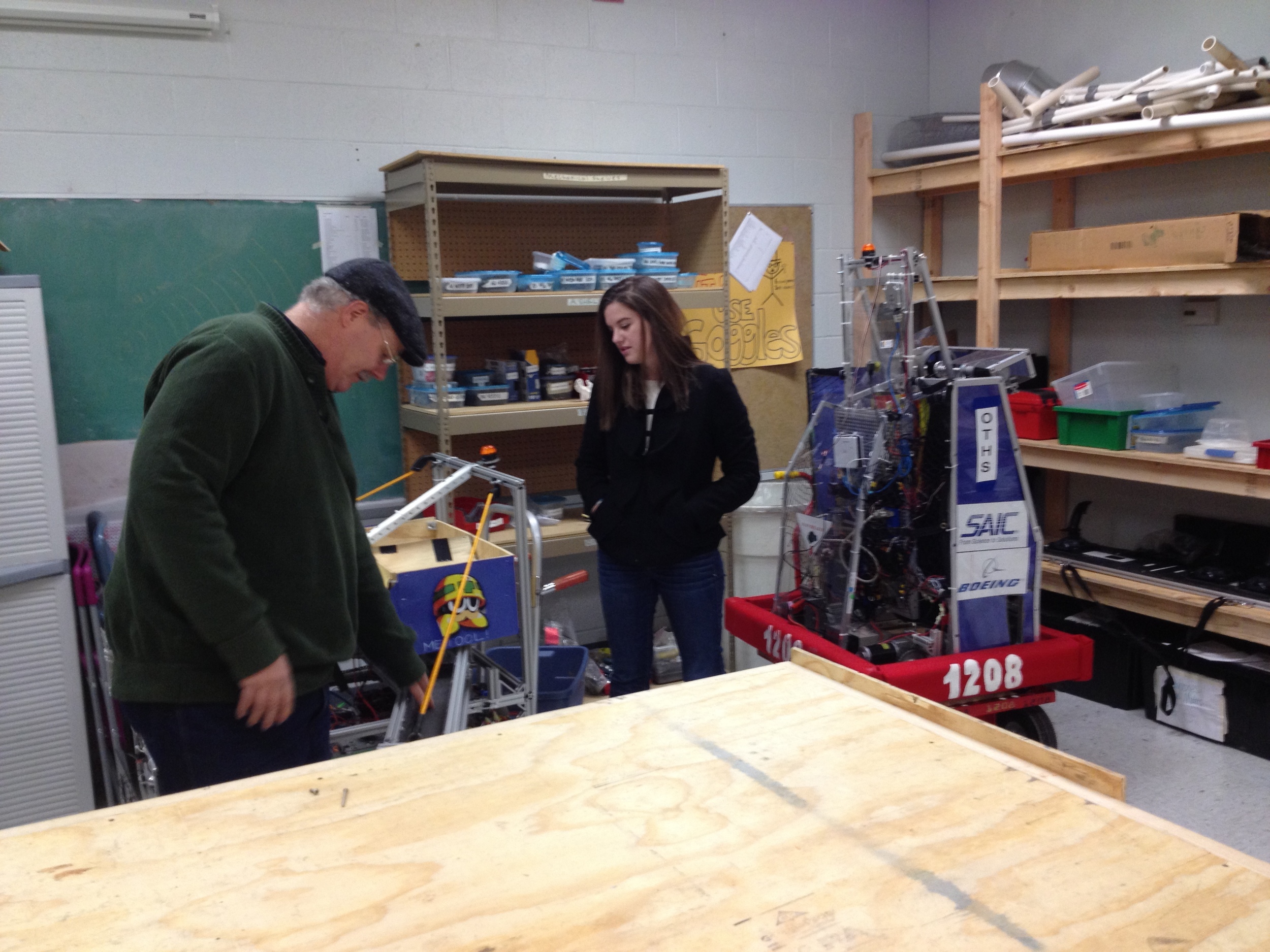  Team 1208 mentor, Mr. Curry, and former team member, Adrienne Bowman, in the new workshop (The Botcave) 