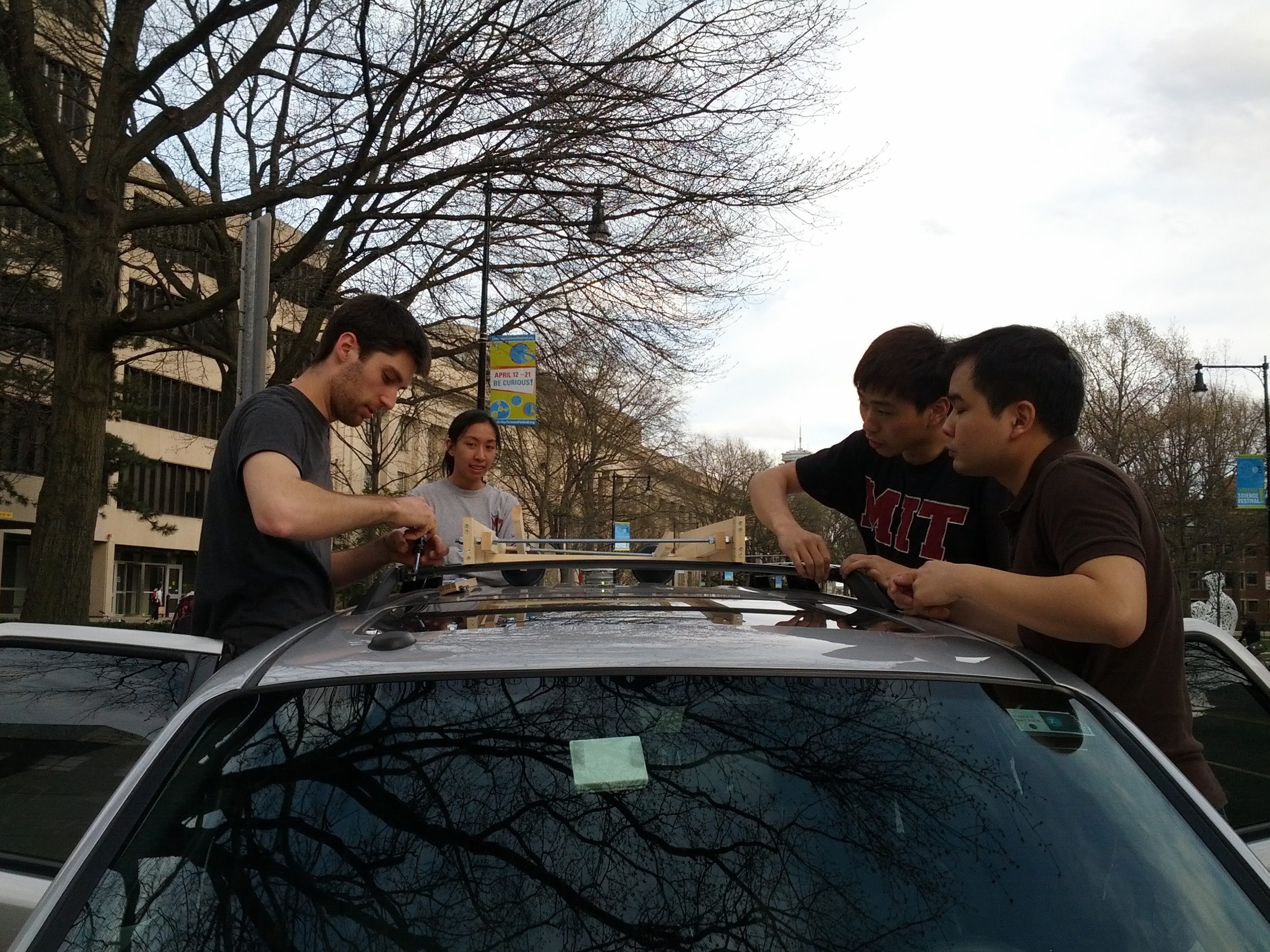  ​Installing the pre-alpha wood prototype on a Ford Escape   