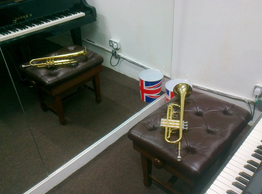 My trumpet with its doppelgänger and a worryingly symbolic waste paper bin.