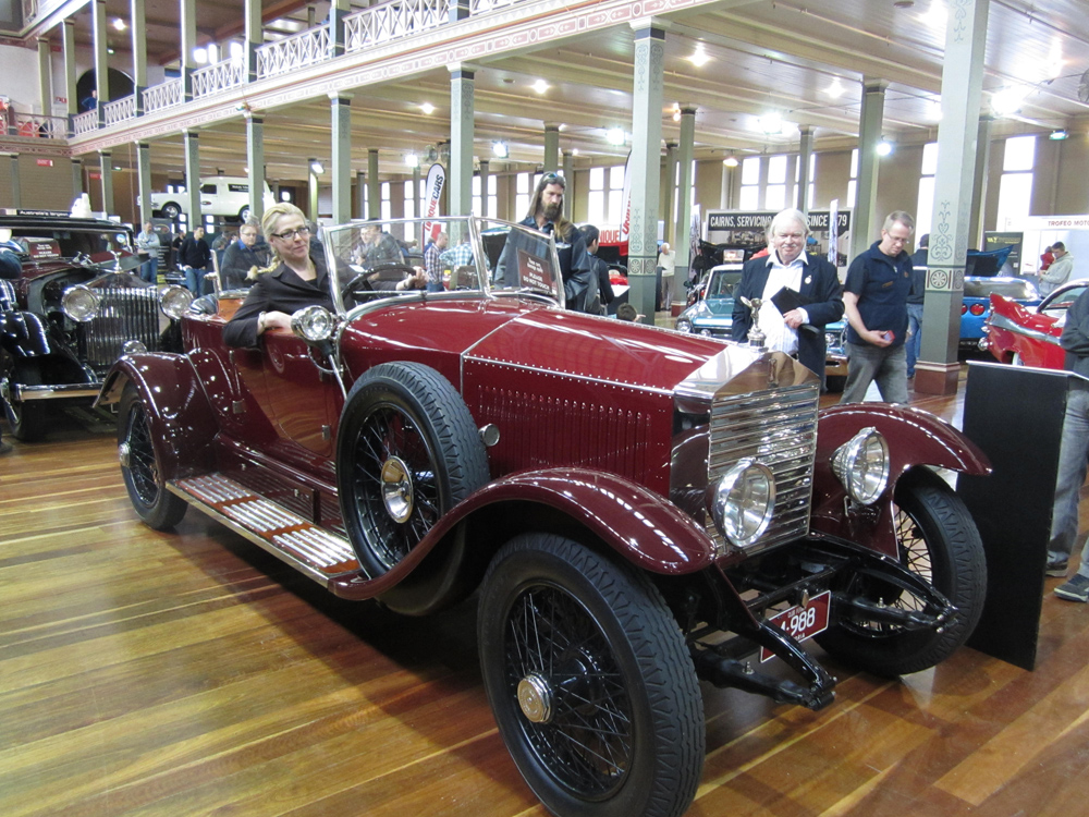 Enjoying the comfort of the driver's seat in a 1926 Rolls Royce Skiff.
