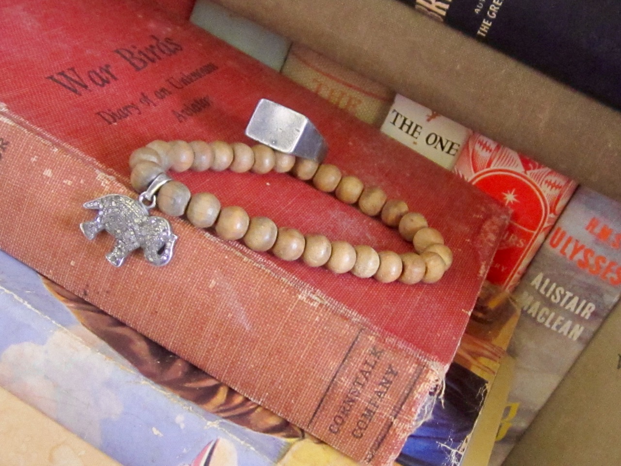 Faded beauty: vintage cloth-bound books shown here with VIX Jewellery distressed signet ring and faded Sandalwood Bead Pave Diamond Bracelet http://tinyurl.com/kg9ukc4