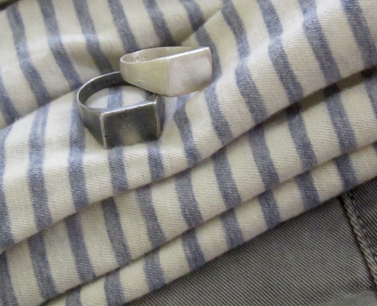 Distressed Signet Rings by VIX, shown here on faded jeans and t-shirt. 