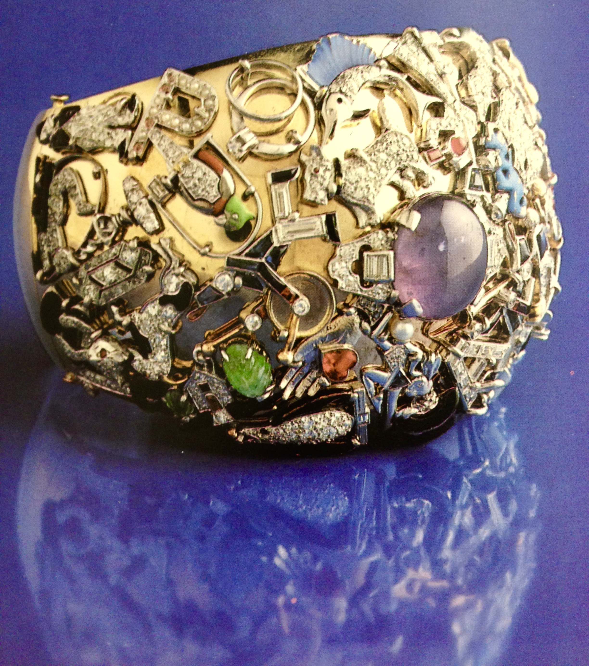 Paulette Goddard was also a savvy little recycler! She had her numerous charms soldered onto a bracelet and a compact.