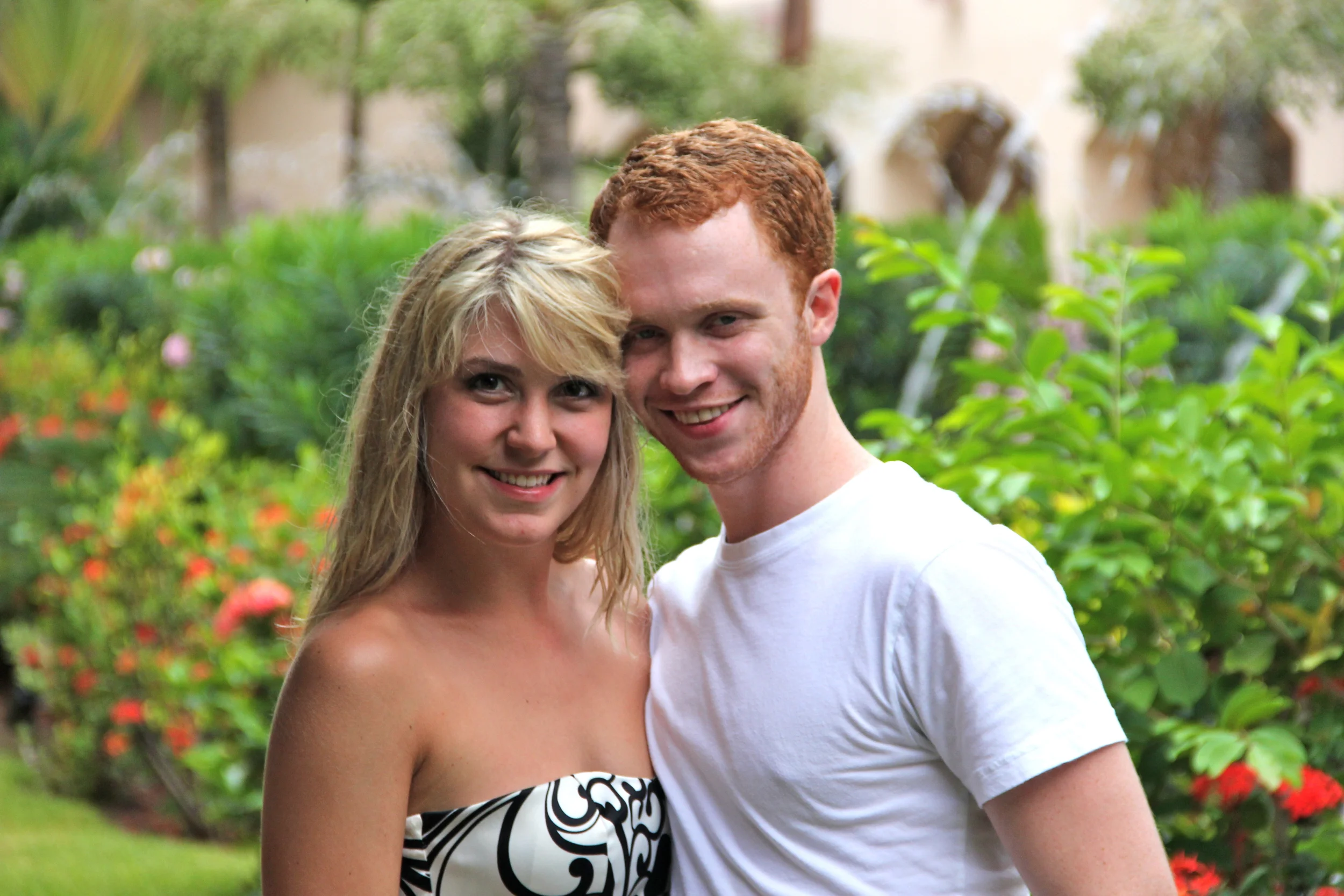 Honeymooners and the GORGEOUS resort background. {photo taken by the couple-friends we met at the resort, Patrick and Rachel!}