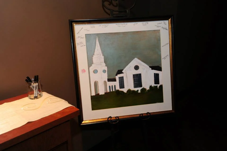 I absolutely ADORED the couple's alternative to the guest book. They had an illustrator paint a gorgeous depiction of their wedding chapel, which was matted and framed for guests to sign, to be hung in the couple's home after the wedding.