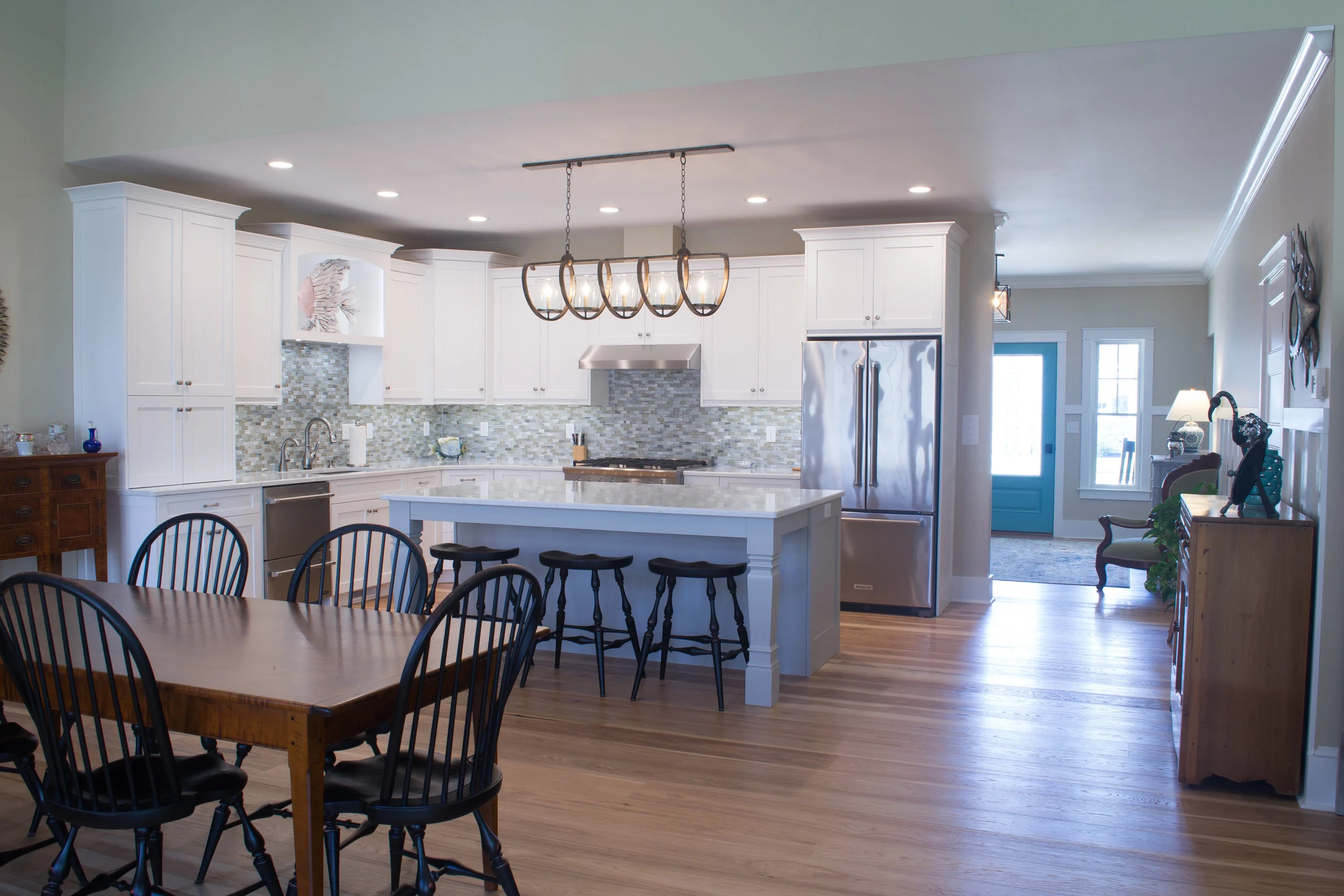 White painted kitchen with grey island