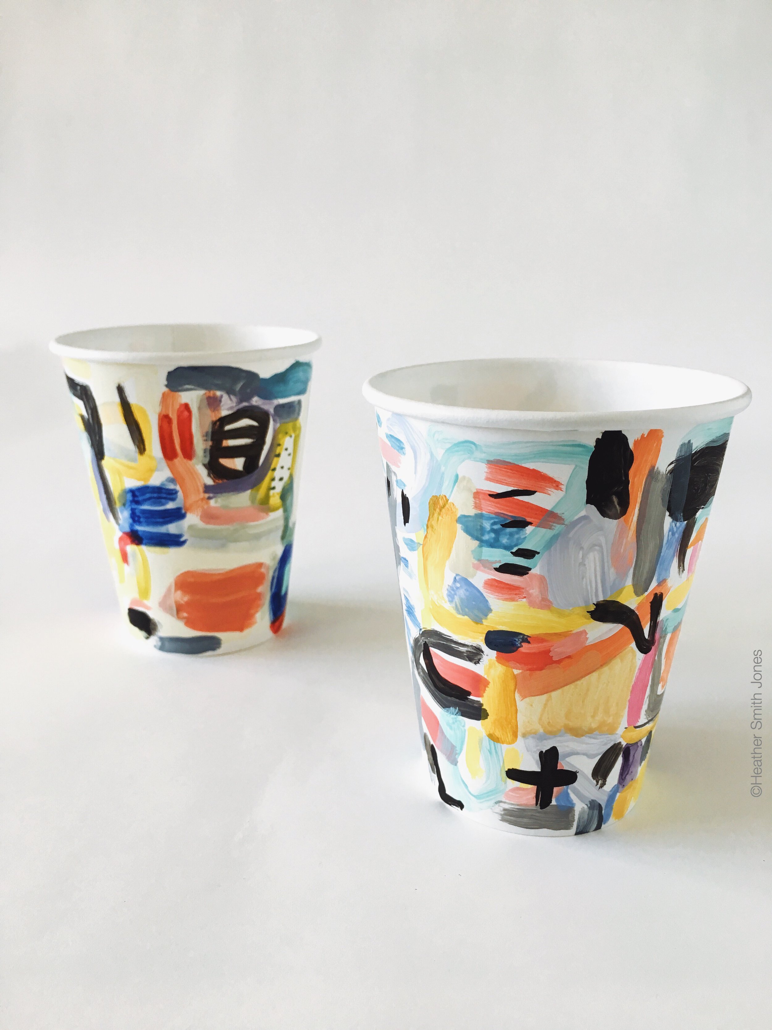 Two cups I painted for the #CautionMayBeHot exhibit on view at Long Weekend.