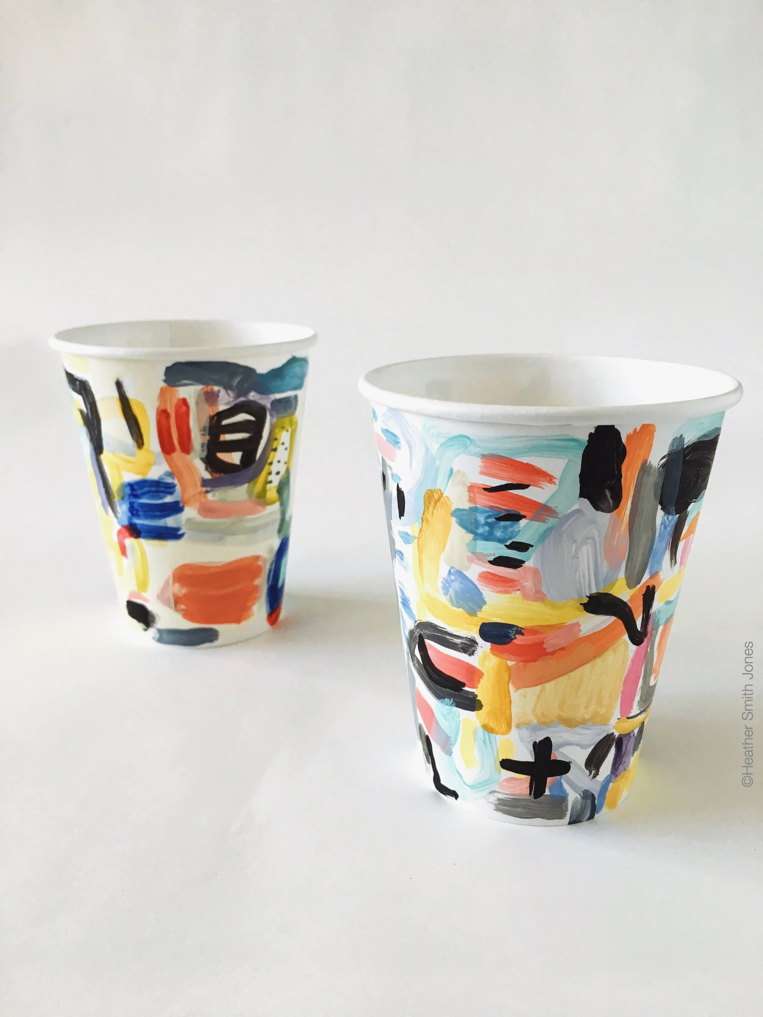 Two cups I painted for the #CautionMayBeHot exhibit on view at Long Weekend.
