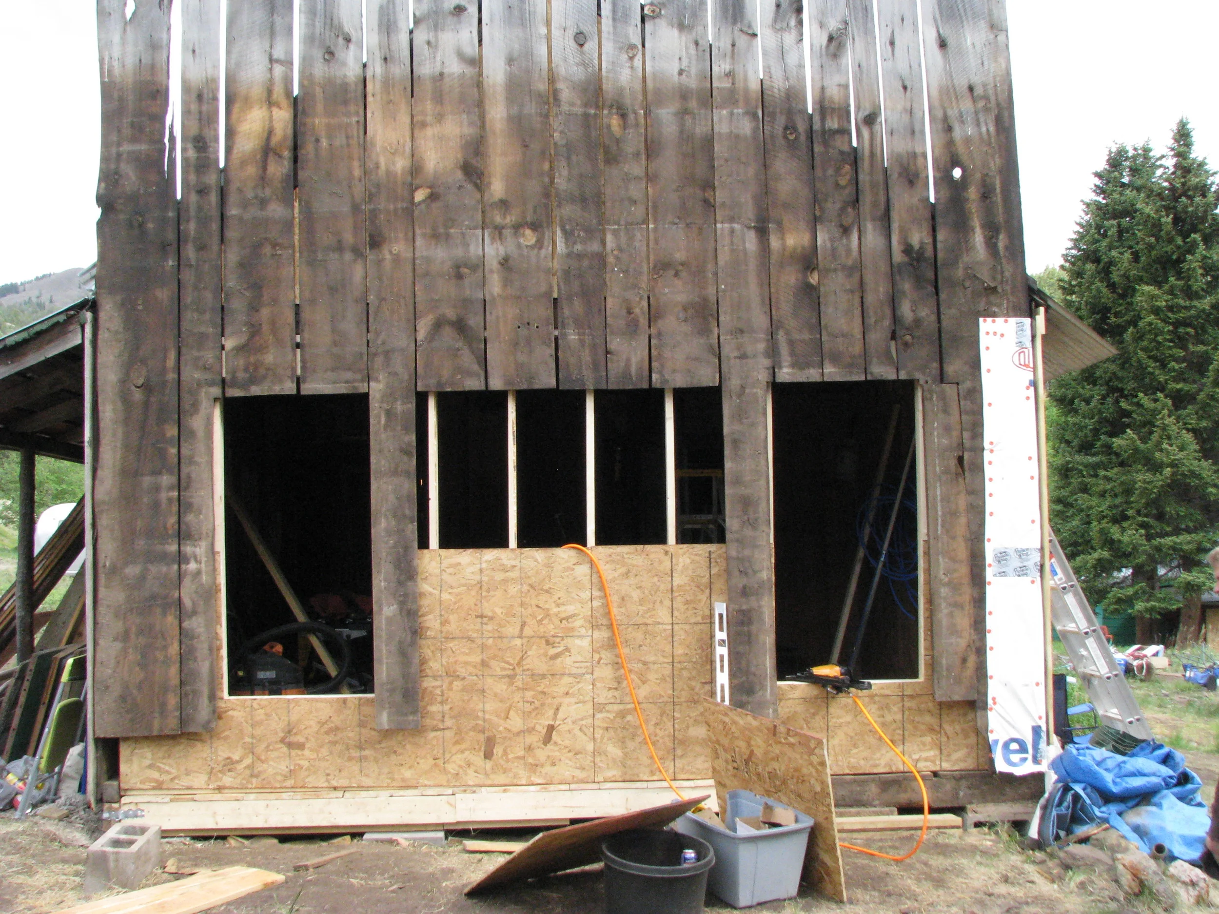  Because the new frame wall was square, they had to insert OSB to bridge the gap between the frame wall and the exterior boards. 