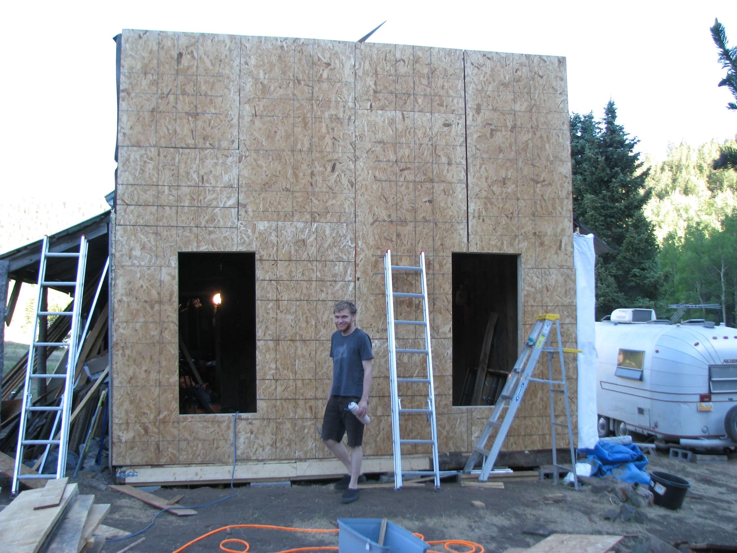  Noah Boswell inspects the window cuts. 