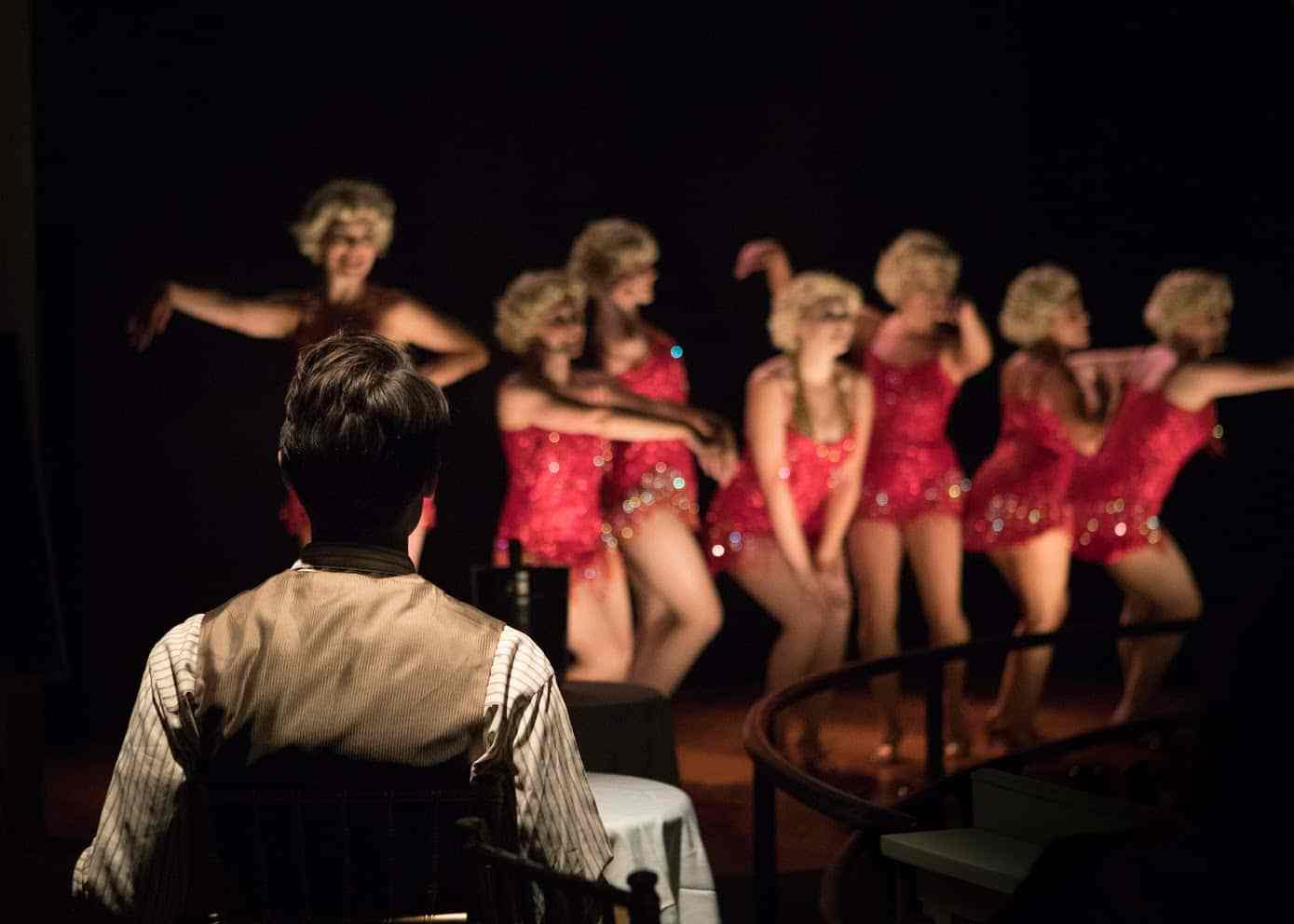 The-Speakeasy.-A-gentleman-takes-in-a-show-in-the-cabaret.-Photo-by-Peter-Liu.jpg